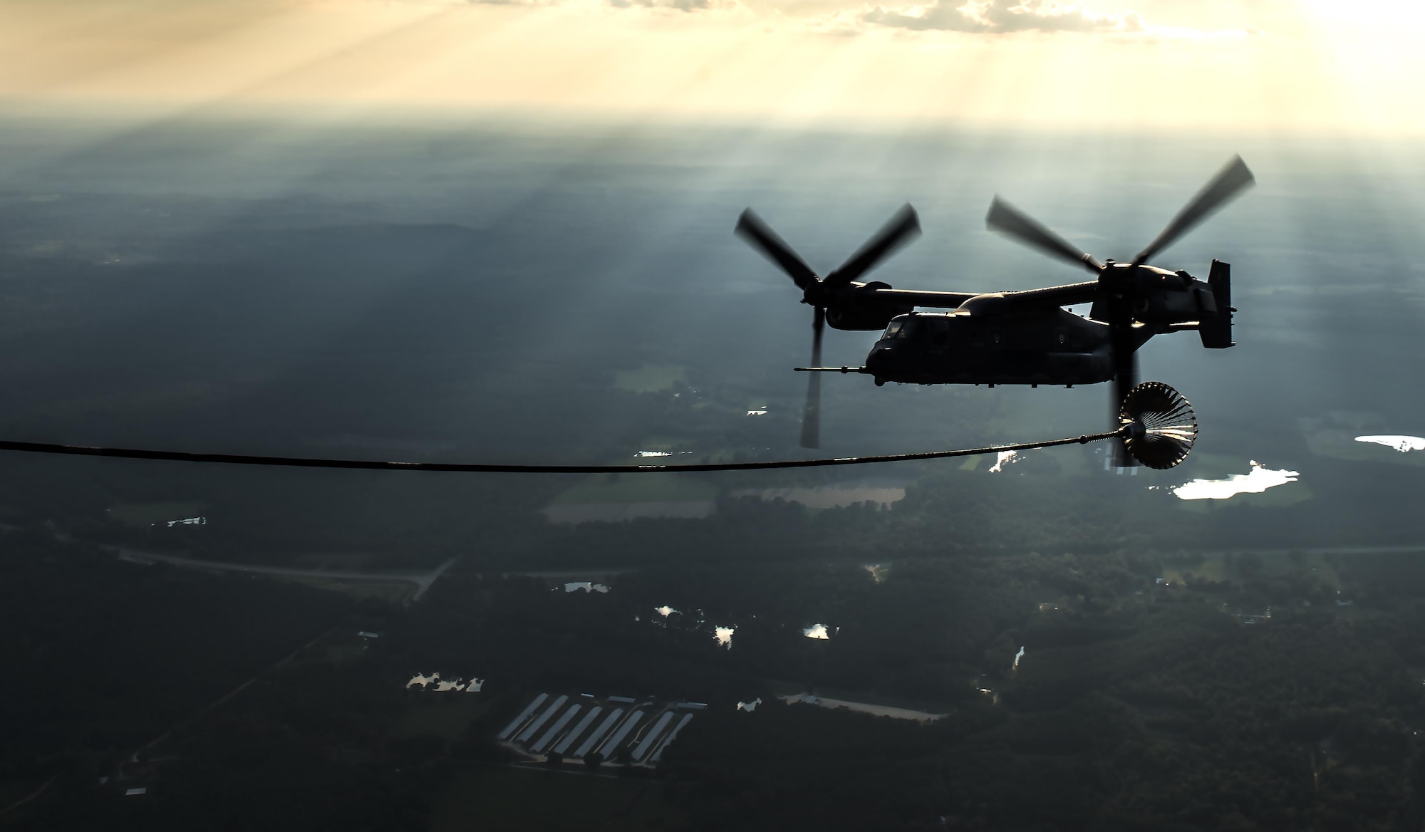 A CV-22 Osprey tiltrotor aircraft approaches an MC-130H Combat Talon II air-refueling receptacle during a training mission at Hurlburt Field, Fla., Sept. 7, 2016. The Osprey is a tiltrotor aircraft that combines the vertical takeoff, hover and vertical landing qualities of a helicopter with the long-range, fuel efficiency and speed characteristics of a turboprop aircraft. (U.S. Air Force photo by Staff Sgt. Christopher Callaway) 