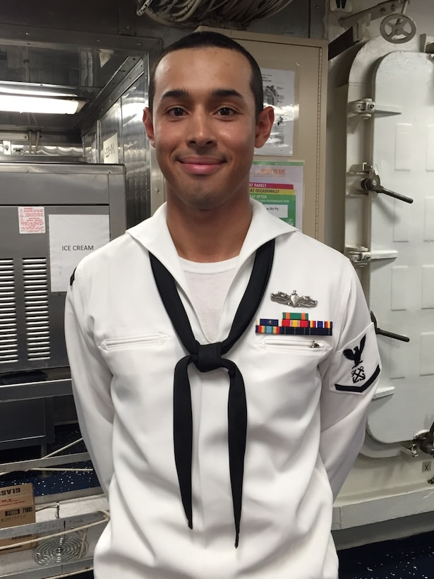 Navy Petty Officer 3rd Class Edilson Lazo, who hails from Lancaster, Pennsylvania, is a boatswain's mate on the USS Barry, an Arleigh Burke-class guided missile destroyer that’s forward-deployed to Yokosuka, Japan. Lazo poses for a photo aboard the USS Barry, Sept. 7, 2016. Lazo is proud of his service and being in the Navy: "It's exciting,” he said. “I enjoy it. I feel like I'm making the world a better place." DoD photo by Lisa Ferdinando