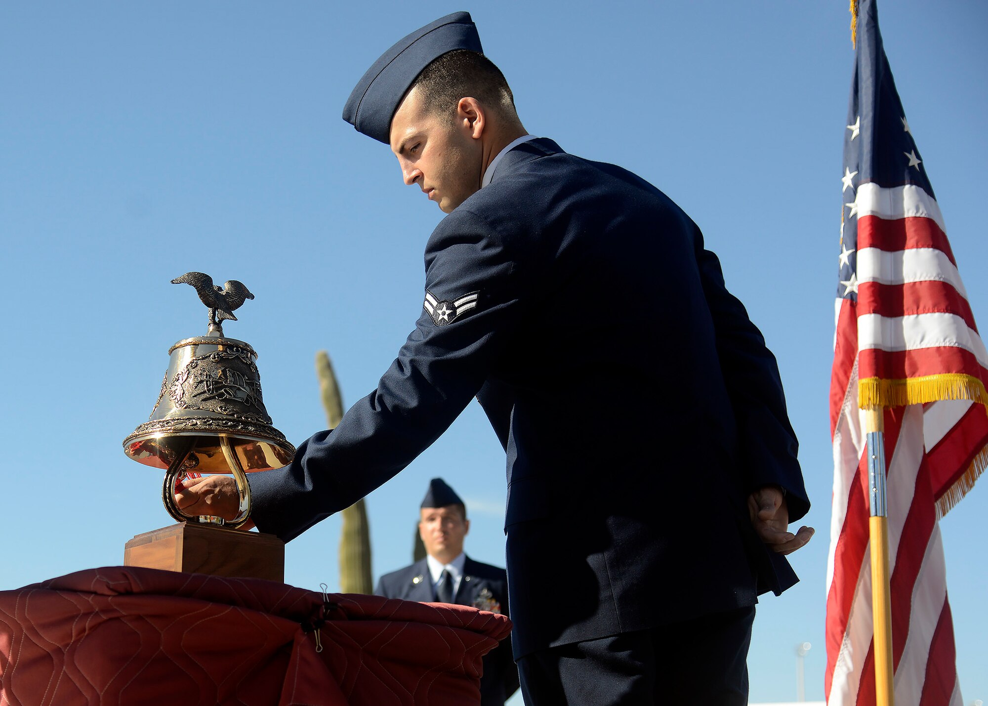 Airman 1st Class Andrew Garcia, 56th Civil Engineer Squadron firefighter, rings the bell to honor the fallen heroes who responded to the terrorist attacks on Sept. 11, 2001 during the 9/11 Tower Tribute ceremony Sept. 9, 2016 at Luke Air Force Base, Ariz. Following the ceremony, Airmen and firefighters from across the base climbed the tower's stairwell to bring streamers bearing the names of the fallen to the top. (U.S. Air Force photo by Senior Airman Devante Williams)