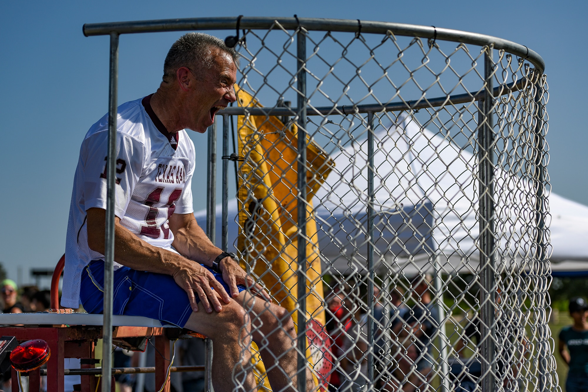 U.S. Air Force Col. Steven Vandewalle, 17th Medical Group commander, taunts a dunk tank contender during the Combined Federal Campaign kickoff tailgate party at the parade field on Goodfellow Air Force Base, Texas, Sept. 8, 2016. The dunk tank, along with several other activities, brought in hundreds of Goodfellow members to kick off the CFC. This year’s goal for the 17th Training Wing is to raise $117,000 for the campaign. (U.S. Air Force photo by Senior Airman Devin Boyer/Released)