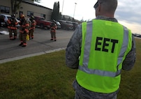 Staff Sgt. Taylor Gerdes, 5th Civil Engineer Squadron firefighter, evaluates firefighters during a fuel spill exercise at Minot Air Force Base, N.D., Sept. 8, 2016. Gerdes was part of the Exercise Evaluation Team during the annual fuel spill training. (U.S. Air Force photo by Staff Sgt. Chad Trujillo)
