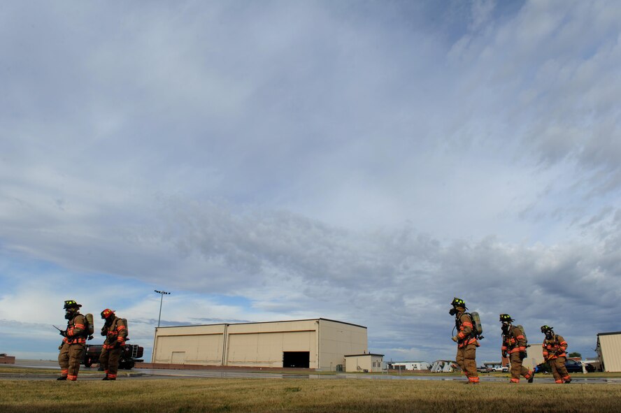 Firefighters from the 5th Civil Engineer Squadron conduct a fuel spill exercise at Minot Air Force Base, N.D., Sept. 8, 2016. The exercise simulated 6000 gallons spilling from a fuel truck and was part of an annual requirement for training. (U.S. Air Force photo by Staff Sgt. Chad Trujillo)
