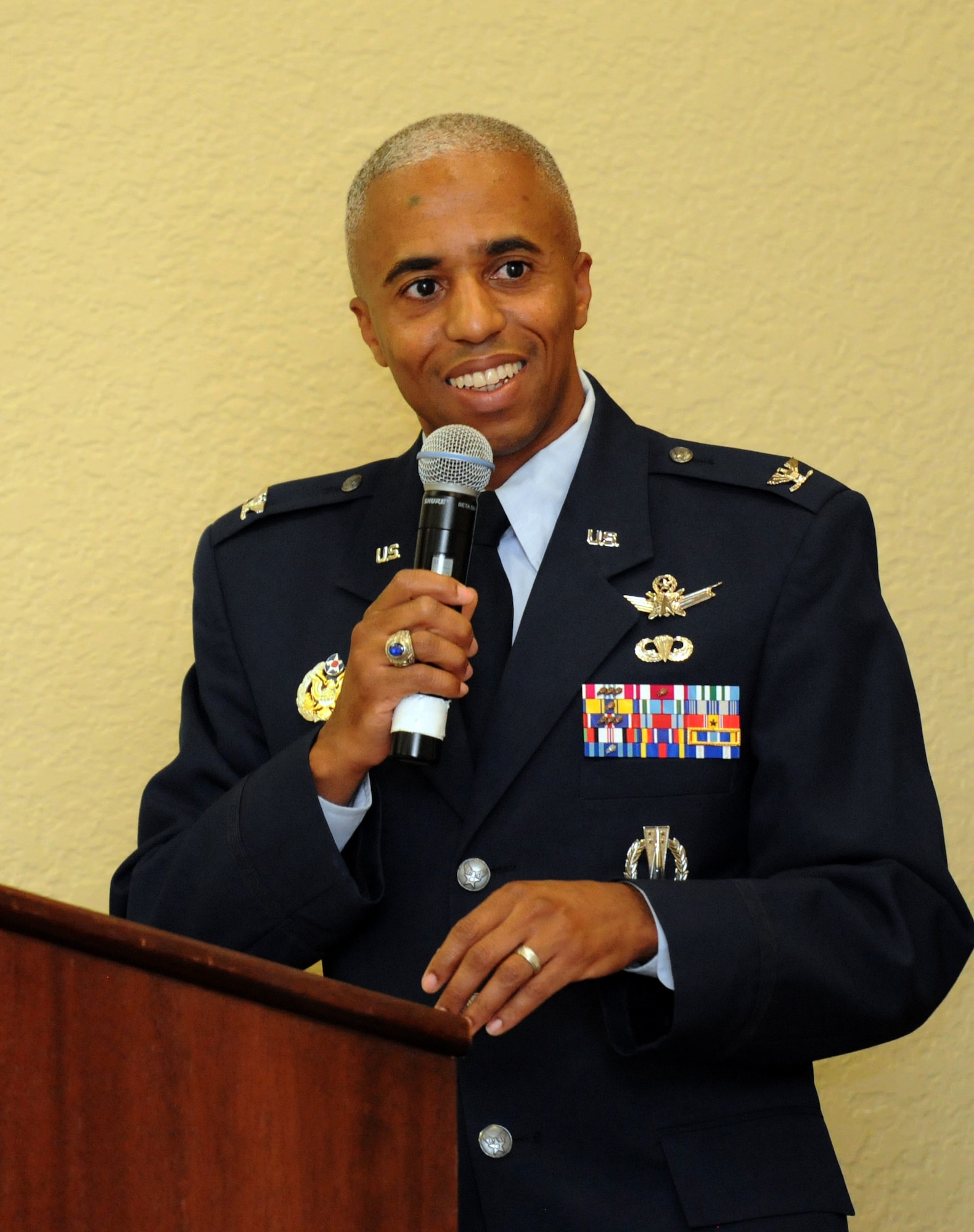 Col. Fred Taylor, Jr., Joint Space Operations Center deputy director and National Reconnaissance Office Liaison, Vandenberg Air Force Base, Calif., delivers remarks about the career of Chief Master Sgt. Robert Winters, 81st Training Group superintendent, during his retirement ceremony at the Bay Breeze Event Center Sept. 8, 2016, on Keesler AFB, Miss. Winters retired with more than 29 years of military service and served multiple assignments in California, Louisiana, Georgia, Colorado, Korea and the United Kingdom. He also worked as an electronic warfare officer in support of more than 700 soldiers in multiple locations throughout Iraq. (U.S. Air Force photo by Kemberly Groue/Released)
