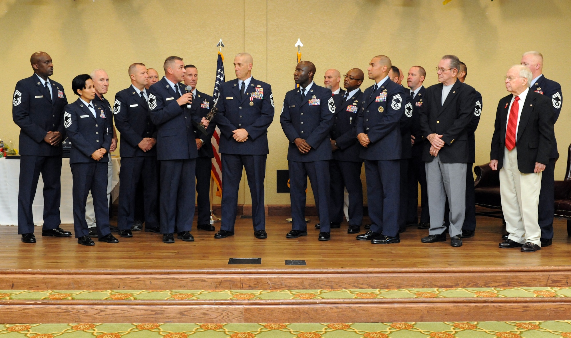 Chief Master Sgt. Leonard Trombley, 81st Training Support Squadron qualification training flight chief, and members of the Keesler Chief’s Group present Chief Master Sgt. Robert Winters, 81st Training Group superintendent, with a gift during his retirement ceremony at the Bay Breeze Event Center Sept. 8, 2016, on Keesler Air Force Base, Miss. Winters retired with more than 29 years of military service and served multiple assignments in California, Louisiana, Georgia, Colorado, Korea, and the United Kingdom. He also worked as an electronic warfare officer in support of more than 700 soldiers in multiple locations throughout Iraq. (U.S. Air Force photo by Kemberly Groue/Released)