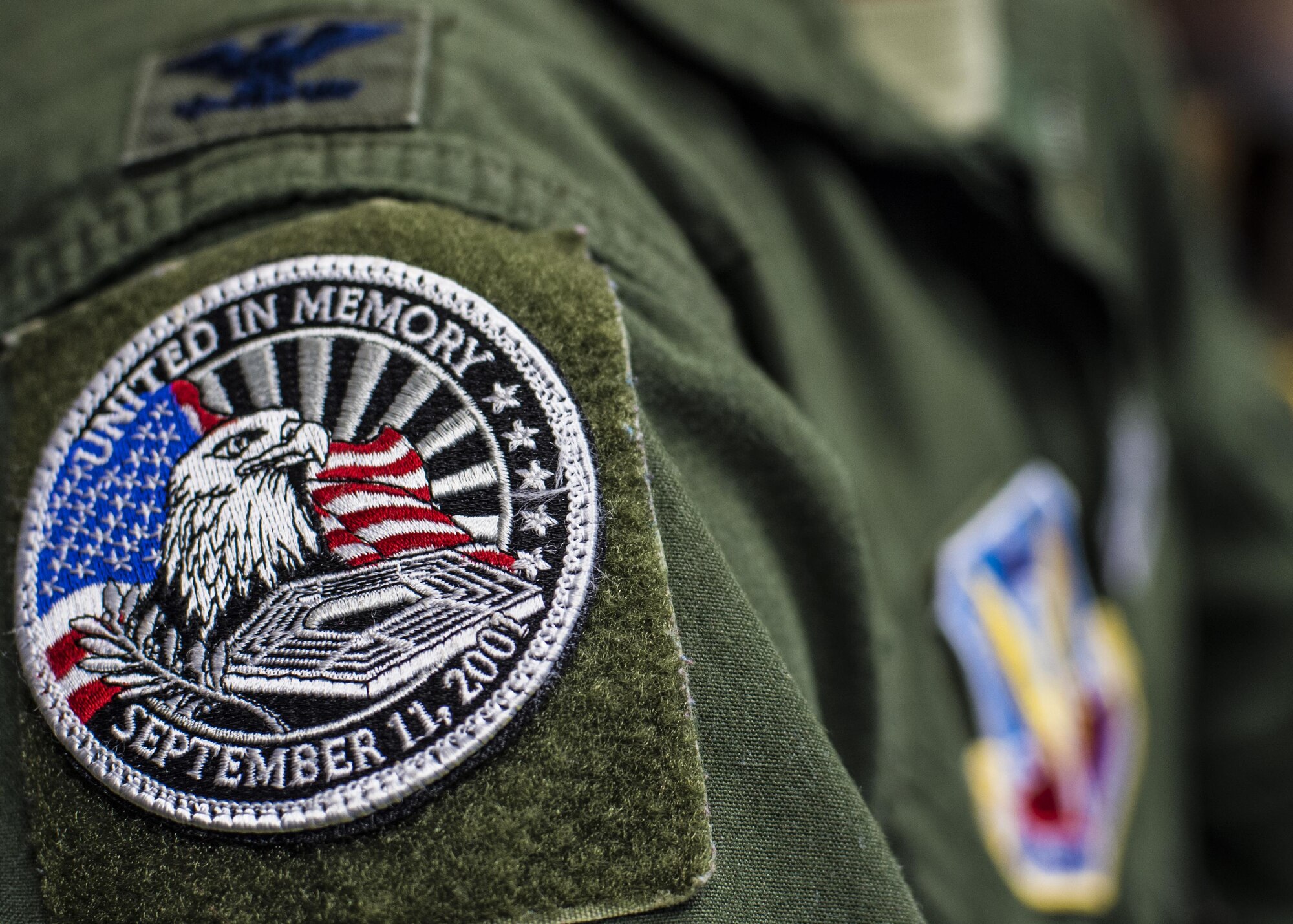 Col. Houston Cantwell, the 49th Wing commander wears a 9/11 remembrance patch on his flight suit at Holloman Air Force Base, N.M., on Sept. 8, 2016. During the terror attacks, Cantwell was working on the fifth floor of the Pentagon, just one corner away from where the airliner struck. (U.S. Air Force photo by Senior Airman Emily Kenney)