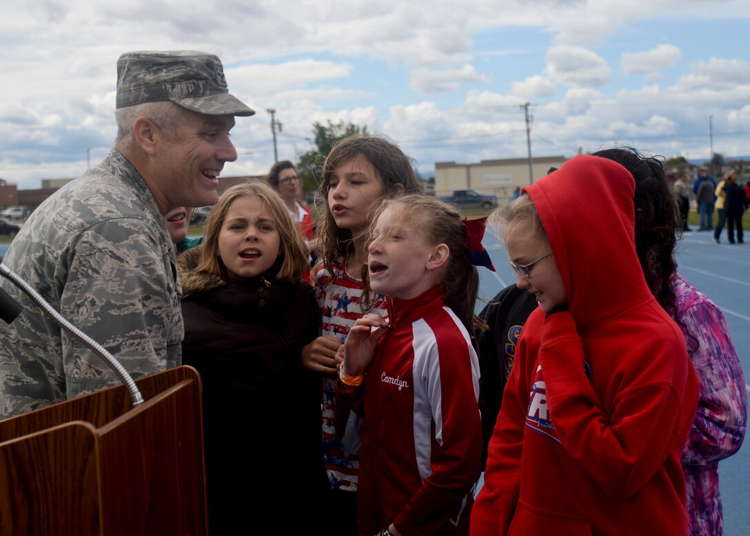 Col. Bernard Hatch III, commander of the 28th Maintenance Group, talks with students after giving a speech to students and faculty members of the Douglas School District during their Freedom Walk in Box Elder S.D., Sept. 9, 2016. The Freedom Walk was a way to observe Patriot Day, a day honoring and remembering the victims of the attacks on Sept. 11, 2001. (U.S. Air Force photo by Airman 1st Class Denise M. Jenson)