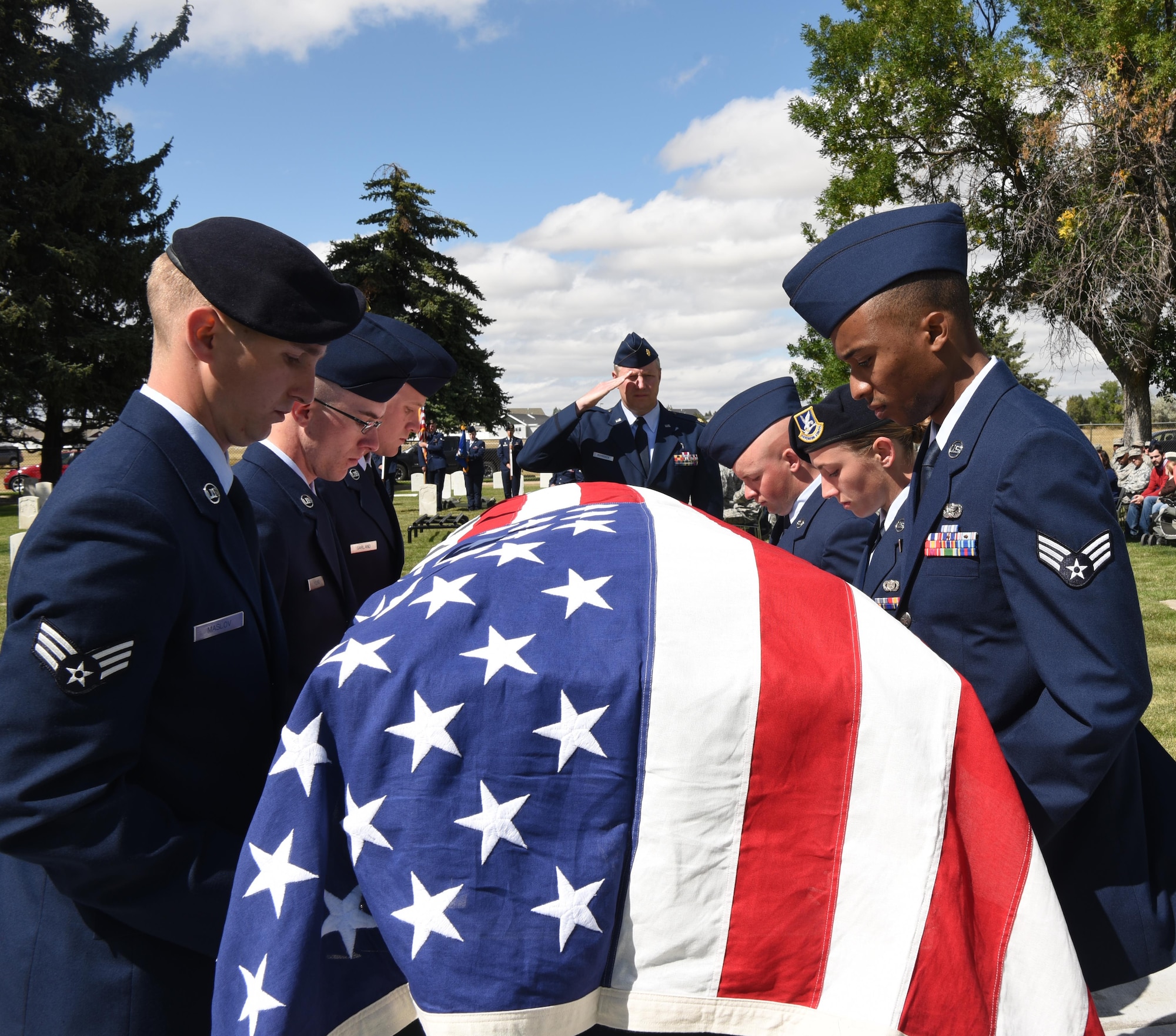 Honor guard graduates carry a casket during a mock funeral on F.E. Warren Air Force Base, Wyo. Sept. 9. Graduates showcased their precision movements during the ceremony. (U.S. Air Force photo by Airman 1st Class Breanna Carter)