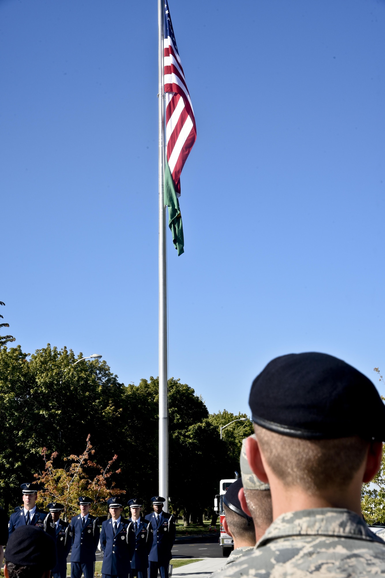 Members from the 92nd Security Forces Squadron watch members from Fairchild's honor guard during the Patriot's Day retreat ceremony Sept. 9, 2016, at Fairchild Air Force Base, Wash. “On the morning of Sept. 11, 2001, 19 terrorists from Al-Qaeda hijacked four commercial airplanes deliberately crashing two of the planes into the upper floors of the North and South Towers of the World Trade Center and a third plane into the Pentagon,” said Senior Airman Jonathan Jones, 92nd Civil Engineer Squadron firefighter, during the ceremony. “The Twin Towers ultimately collapsed because of the damage sustained from the impacts and the resulting fires.” (U.S. Air Force photo/Airman 1st Class Taylor Shelton)