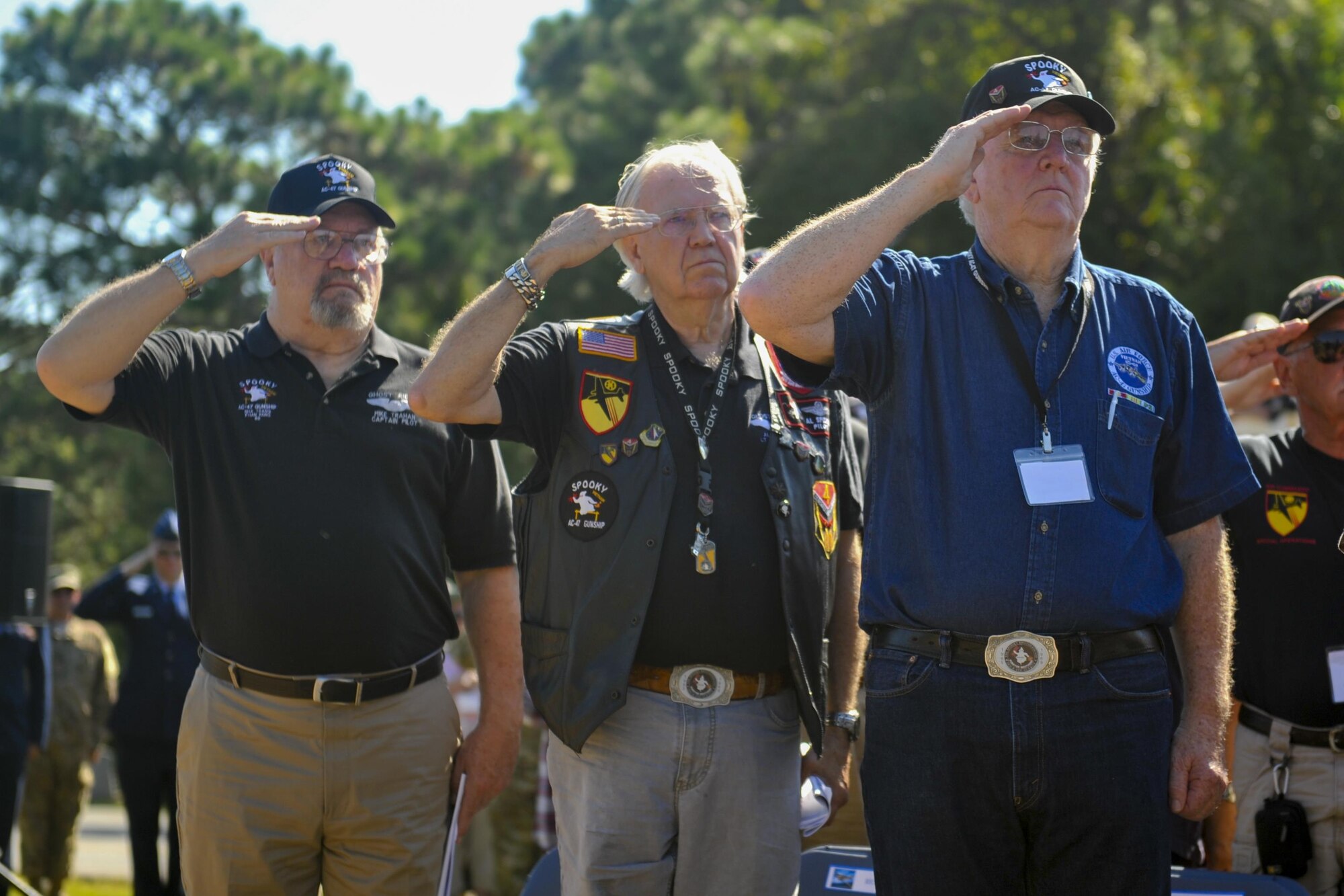 Members of the AC-47 Spooky Gunship Brotherhood salute while the national anthem is sang during a plaque dedication ceremony at the Hurlburt Field Air Park, Fla., Sept. 9, 2016. The first AC-47 combat missions took place December 1964 during the Vietnam War. Within a year, they flew missions throughout South Vietnam providing local defense at night. On thousands of occasions, Spooky crews prevented friendly ground positions from being overrun. (U.S. Air Force photo by Airman Dennis)