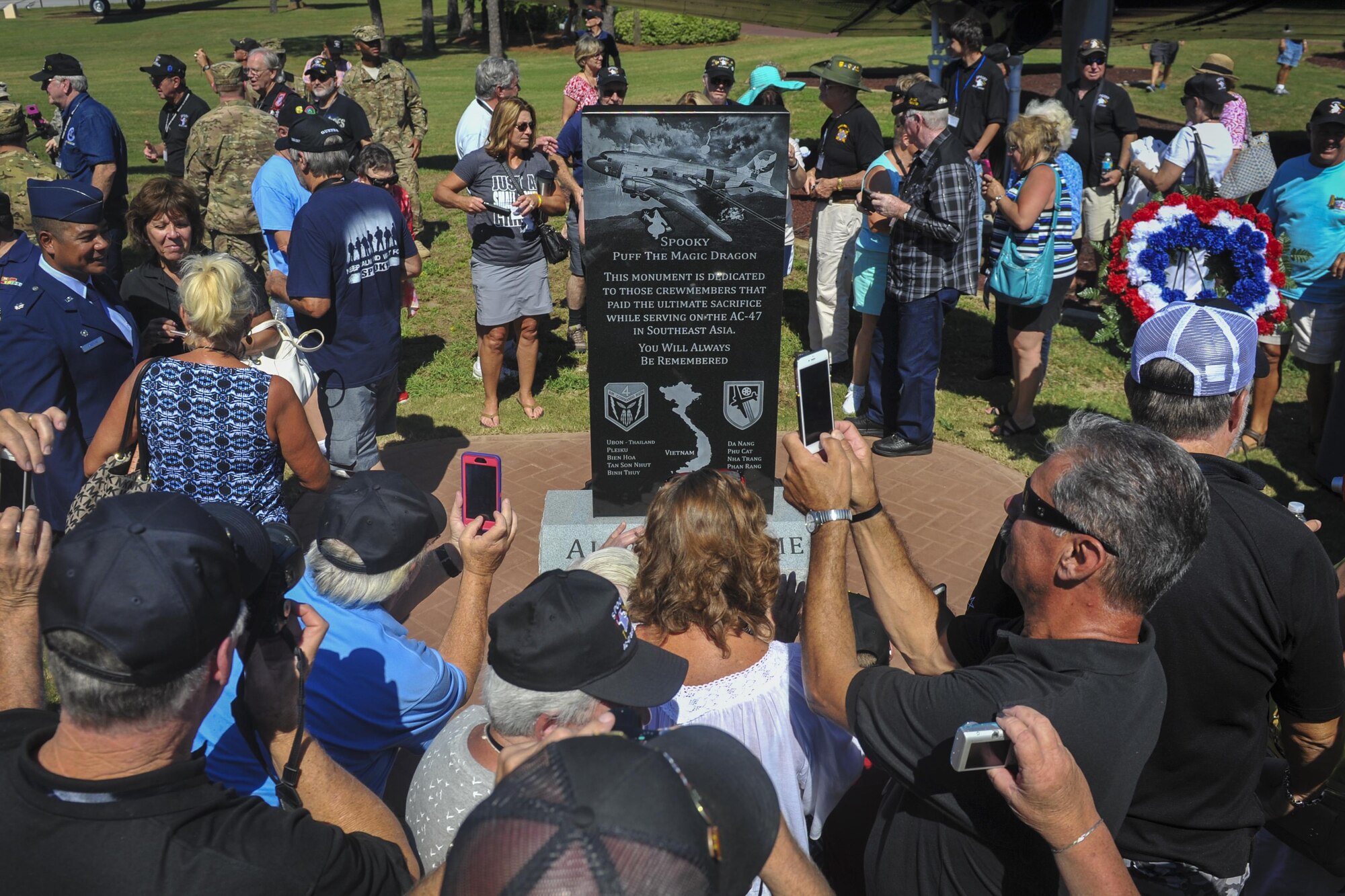 Members of the AC-47 Spooky Gunship Brotherhood mingle around a new plaque after a dedication ceremony at the Hurlburt Field Air Park, Fla., Sept. 9, 2016. The Spooky brotherhood purchased the memorial plaque with the names of fallen AC-47 crewmembers, who served in Southeast Asia. (U.S. Air Force photo by Airman Dennis Spain)
