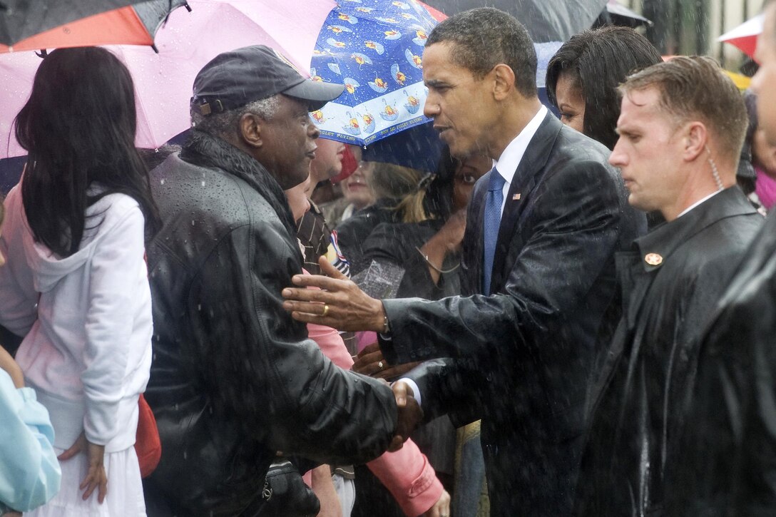 President Barack Obama greets family members attending the Pentagon commemoration ceremony marking the eighth anniversary of the terrorist attacks that killed 59 passengers on hijacked American Airlines flight 77 and 125 inside the building, Sept. 11, 2009. DoD photo by Petty Officer 1st Class Chad J. McNeeley