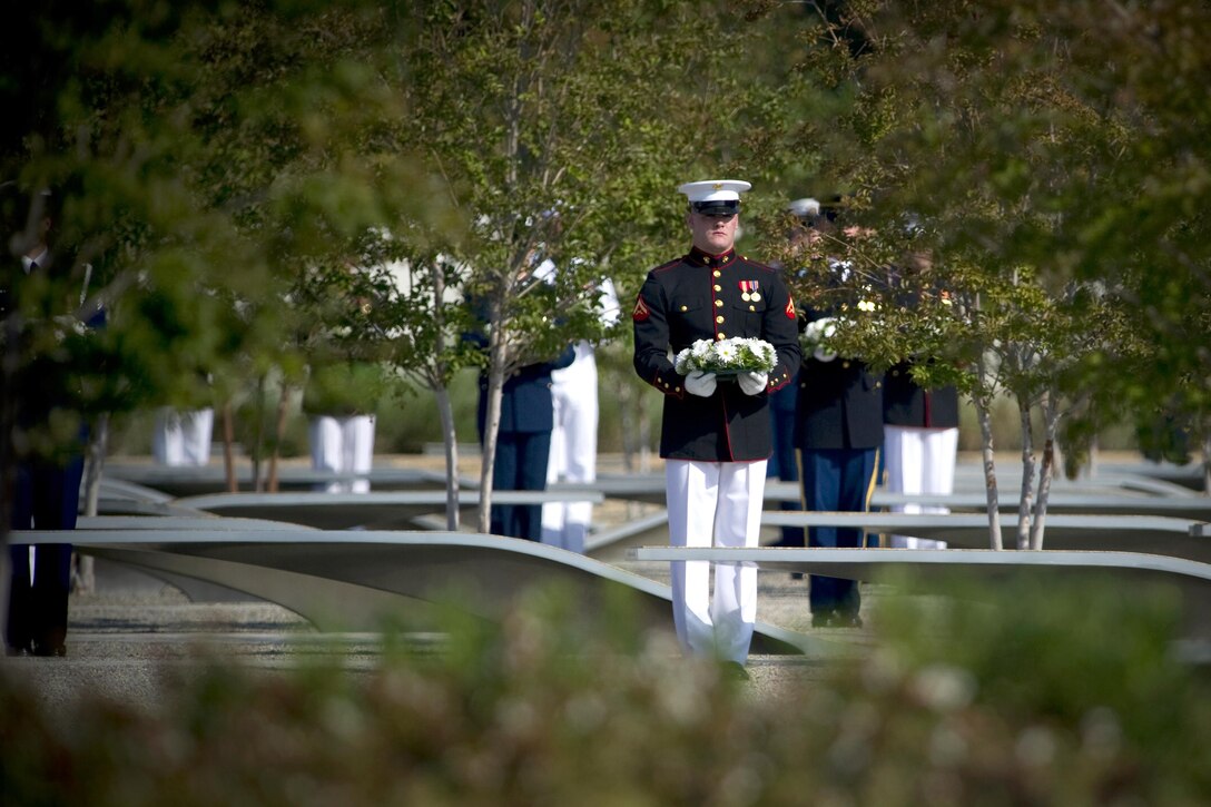 A Marine holds a wreath at the Pentagon 9/11 observance ceremony, Sept. 11, 2011, to honor the 184 victims killed when American Airlines Flight 77 crashed into the Pentagon during a terrorist attack 10 years ago. DOD photo by U.S. Navy Petty Officer 1st Class Chad J. McNeeley