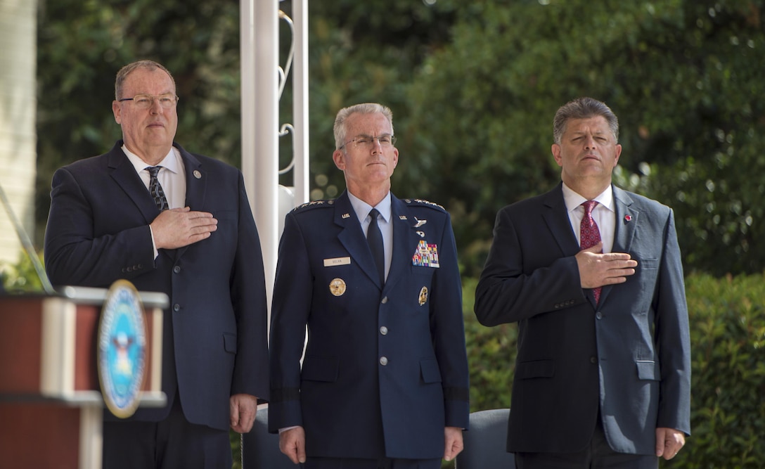 Left to right: Deputy Defense Secretary Bob Work; Air Force Gen. Paul J. Selva, vice chairman of the Joint Chiefs of Staff; and Michael L. Rhodes, the Defense Department's director of administration and management, honor the flag during a remembrance ceremony at the Pentagon, Sept. 9, 2016, to mark the 15th anniversary of 9/11. DoD photo by Army Sgt. Amber I. Smith