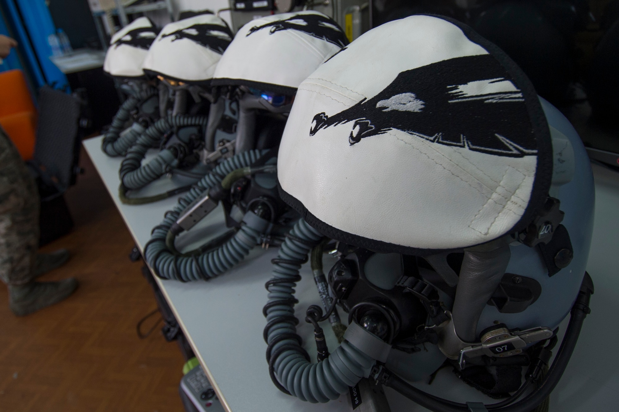 A collection of helmets belonging to California Air National Guard F-15C Eagle fighter aircraft pilots remain on a table at the 194th Expeditionary Fighter Squadron’s flight operations room at Graf Ignatievo, Bulgaria, Sept. 8, 2016. Four of the squadron’s F-15Cs will conduct joint NATO air policing missions with the Bulgarian air force to police the host nation’s sovereign airspace Sept. 9-16, 2016. The squadron forward deployed to Graf Ignatievo from Campia Turzii, Romania, where they serve on a theater security package deployment to Europe as a part of Operation Atlantic Resolve. (U.S. Air Force photo by Staff Sgt. Joe W. McFadden) 