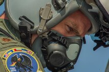 California Air National Guard Maj. Brett Faber, a 194th Expeditionary Fighter Squadron F-15C Eagle fighter aircraft pilot, looks at the controls of his aircraft on the flightline at Graf Ignatievo, Bulgaria, Sept. 8, 2016. Four of the squadron’s F-15Cs will conduct joint NATO air policing missions with the Bulgarian air force to police the host nation’s sovereign airspace. The squadron forward deployed to Graf Ignatievo from Campia Turzii, Romania, where they serve on a theater security package deployment to Europe as a part of Operation Atlantic Resolve. (U.S. Air Force photo by Staff Sgt. Joe W. McFadden) 