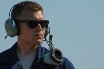 California Air National Guard Staff Sgt. Zechery Blackburn, a 194th Expeditionary Fighter Squadron crew chief, watches as an F-15C Eagle fighter aircraft prepares to taxi from the flightline at Graf Ignatievo, Bulgaria, Sept. 8, 2016. Four of the squadron’s F-15Cs will conduct joint NATO air policing missions with the Bulgarian air force to police the host nation’s sovereign airspace Sept. 9-16, 2016. The squadron forward deployed to Graf Ignatievo from Campia Turzii, Romania, where they serve on a theater security package deployment to Europe as a part of Operation Atlantic Resolve. (U.S. Air Force photo by Staff Sgt. Joe W. McFadden) 