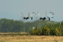 Two Bulgarian air force Mikoyan MiG-29 fighter aircraft assigned to the 3rd Air Force Base take off from the flightline at Graf Ignatievo, Bulgaria, Sept. 8, 2016. Four California and Massachusetts Air National Guard's F-15C Eagle fighter aircraft from the 194th Expeditionary Fighter Squadron will conduct joint NATO air policing missions with the Bulgarian air force to police the host nation’s sovereign airspace Sept. 9-16, 2016. The squadron forward deployed to Graf Ignatievo from Campia Turzii, Romania, where they serve on a theater security package deployment to Europe as a part of Operation Atlantic Resolve. (U.S. Air Force photo by Staff Sgt. Joe W. McFadden) 