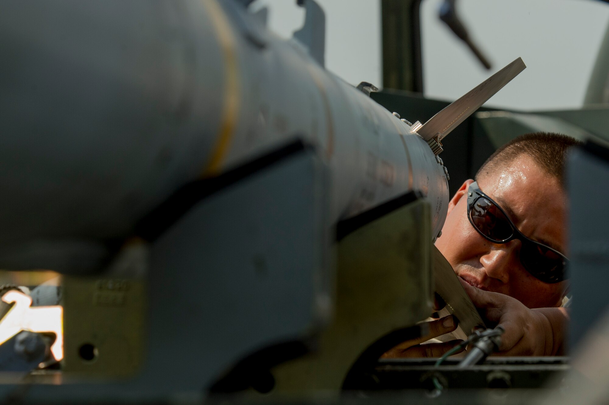 California Air National Guard Staff Sgt. Moau Koau, a 194th Expeditionary Fighter Squadron weapons craftsman, affixes wings on an AIM-120 advanced medium-range air-to-air missile on the flightline at Graf Ignatievo, Bulgaria, Sept. 8, 2016. Four of the squadron’s F-15C Eagle fighter aircraft will conduct joint NATO air policing missions with the Bulgarian air force to police the host nation’s sovereign airspace Sept. 9-16, 2016. The squadron forward deployed to Graf Ignatievo from Campia Turzii, Romania, where they serve on a theater security package deployment to Europe as a part of Operation Atlantic Resolve. (U.S. Air Force photo by Staff Sgt. Joe W. McFadden) 