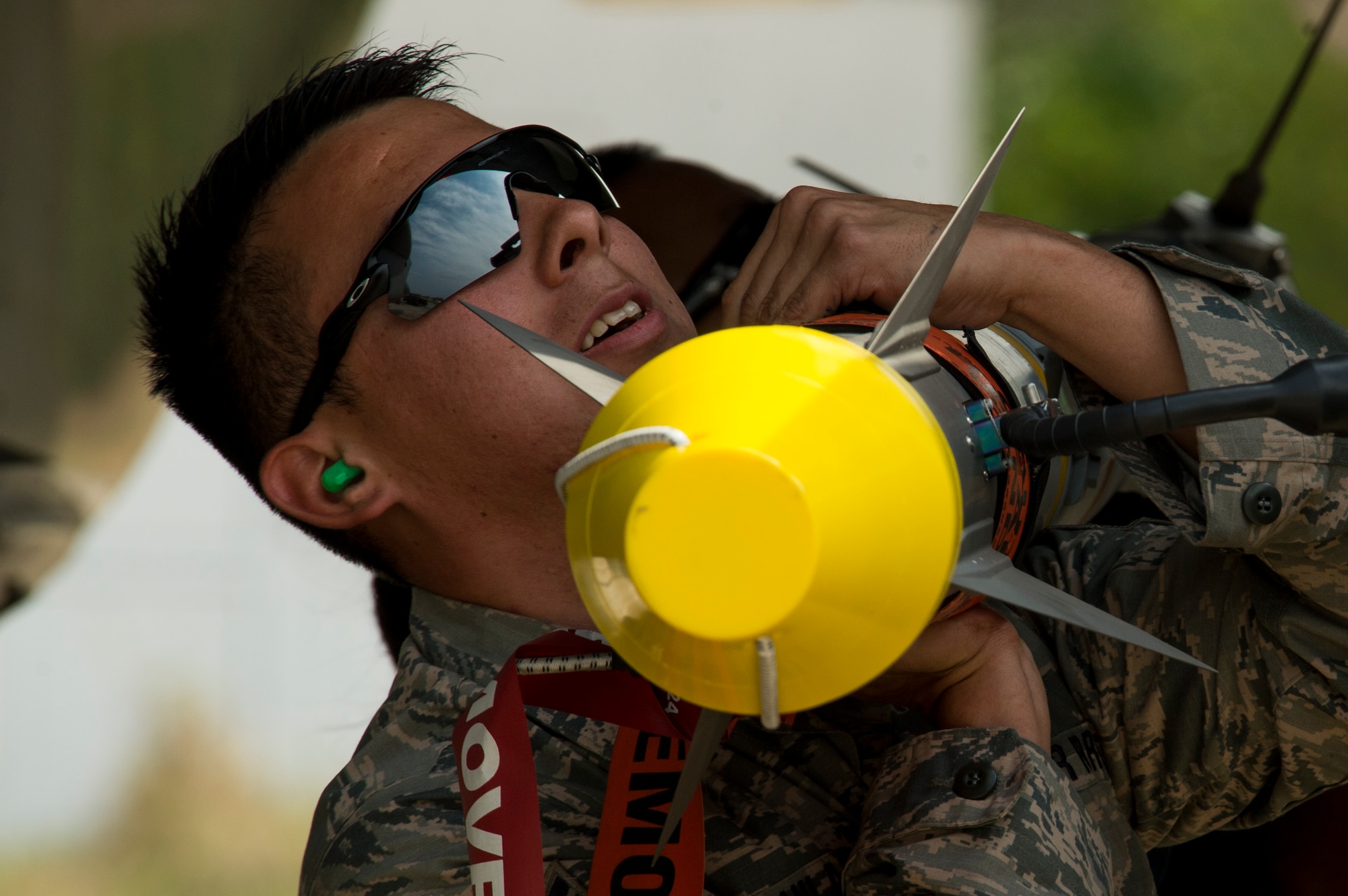 California Air National Guard Staff Sgt. Pedro Aguillar, a 194th Expeditionary Fighter Squadron weapons craftsman, lifts an AIM-9 sidewinder missile to be loaded into an F-15C Eagle fighter aircraft on the flightline at Graf Ignatievo, Bulgaria, Sept. 8, 2016. Four of the squadron’s F-15Cs will conduct joint NATO air policing missions with the Bulgarian air force to police the host nation’s sovereign airspace Sept. 9-16, 2016. The squadron forward deployed to Graf Ignatievo from Campia Turzii, Romania, where they serve on a theater security package deployment to Europe as a part of Operation Atlantic Resolve. (U.S. Air Force photo by Staff Sgt. Joe W. McFadden) 