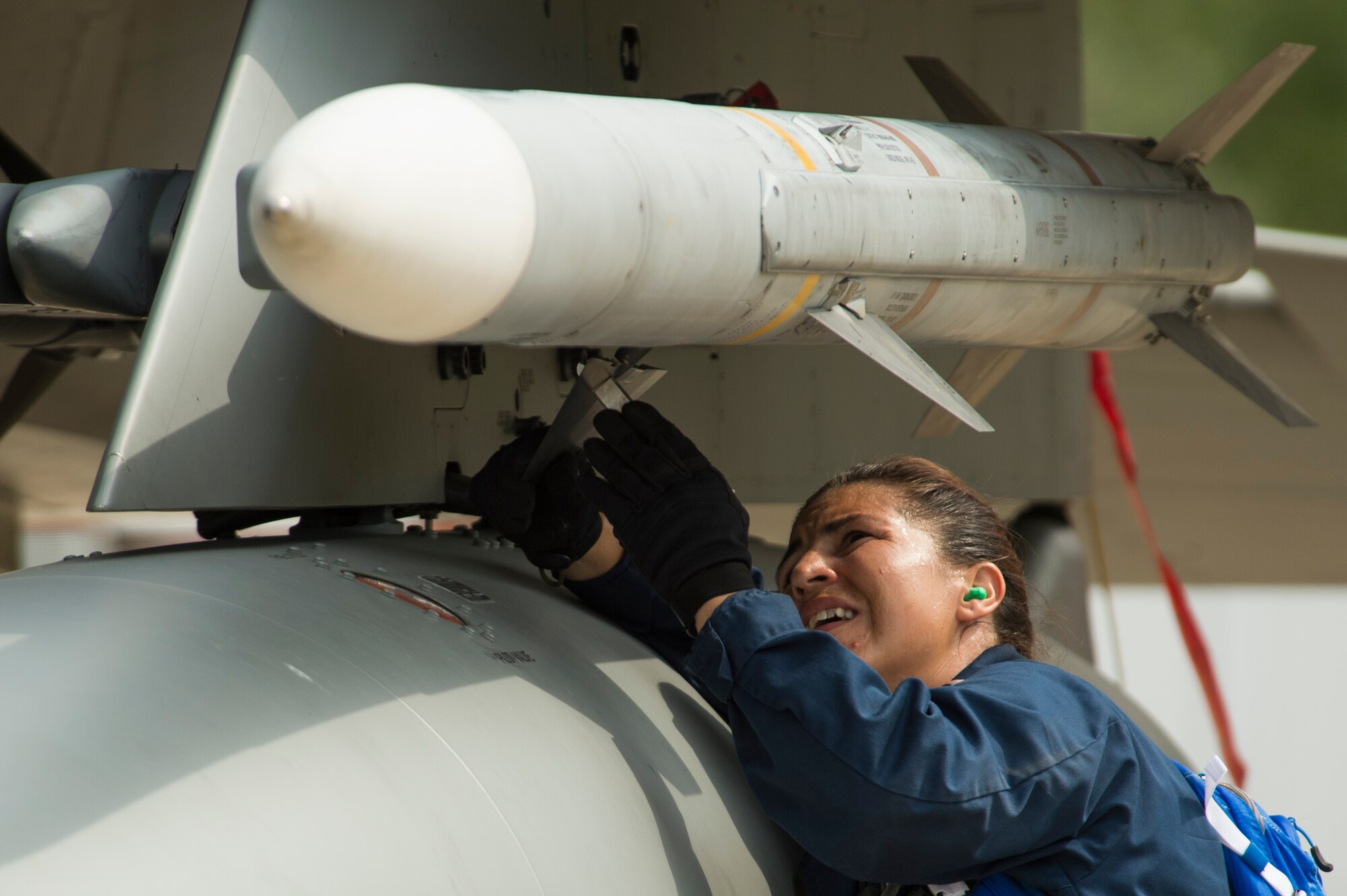 California Air National Guard Master Sgt. Audra Jimenez, a 194th Expeditionary Fighter Squadron weapons craftsman, affixes an AIM-120 advanced medium-range air-to-air missile onto an F-15C Eagle fighter aircraft on the flightline at Graf Ignatievo, Bulgaria, Sept. 8, 2016. Four of the squadron’s F-15Cs will conduct joint NATO air policing missions with the Bulgarian air force to police the host nation’s sovereign airspace Sept. 9-16, 2016. The squadron forward deployed to Graf Ignatievo from Campia Turzii, Romania, where they serve on a theater security package deployment to Europe as a part of Operation Atlantic Resolve. (U.S. Air Force photo by Staff Sgt. Joe W. McFadden) 