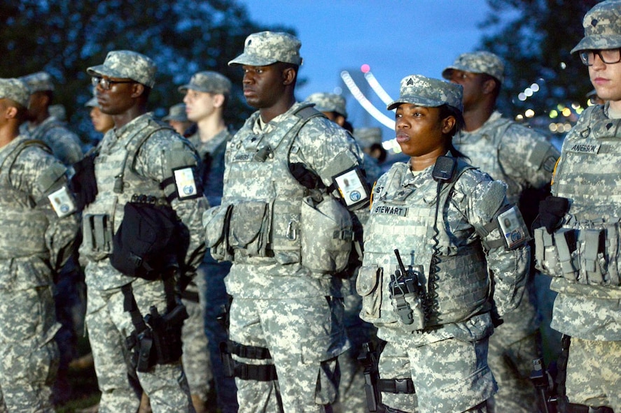 Soldiers and airmen with Joint Task Force Empire Shield stand in formation