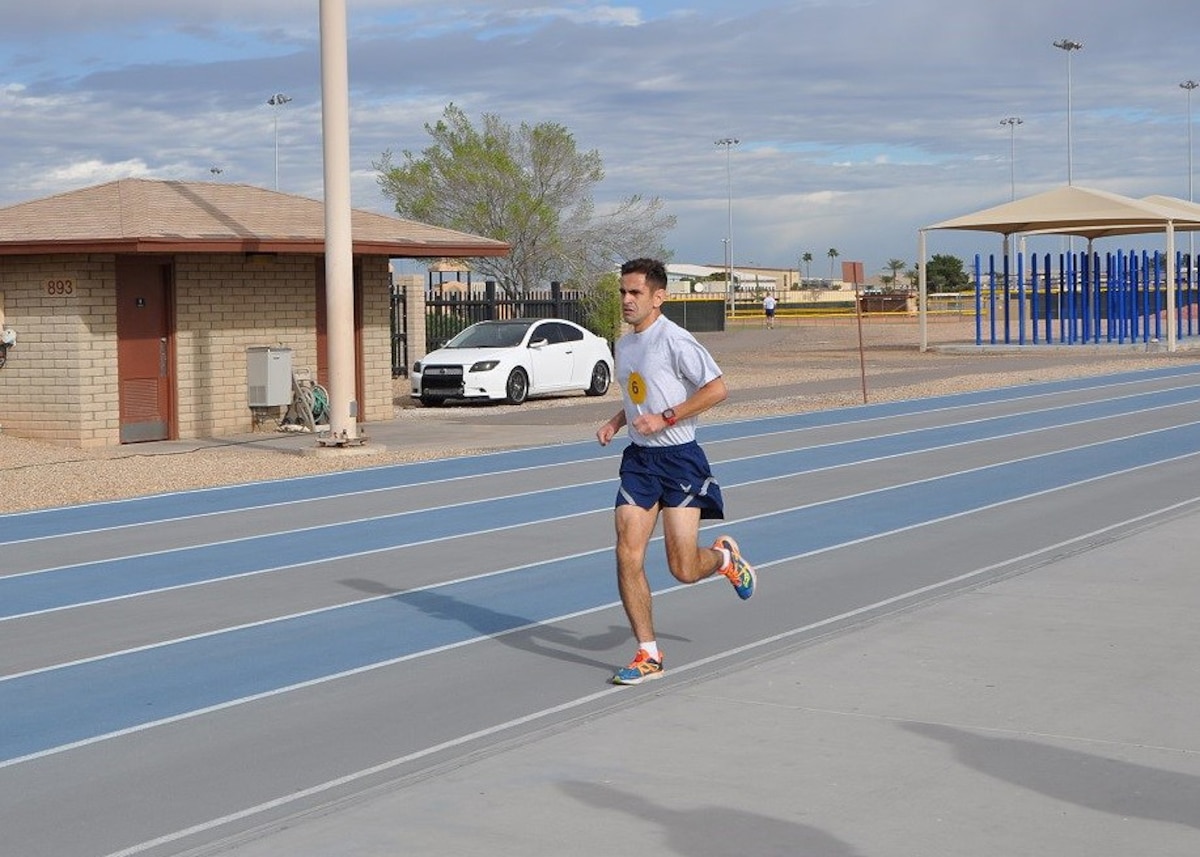 Staff Sgt. Christian Enriquez, 944th Fighter Wing Det. 1 Maintenance Squadron, F16 avionics craftsman ran into the Luke AFB history books earlier this year.  Running 1.5 miles in 8:10 minutes secured his success of beating the current record of 8:24 which was set at Luke on June 25, 2014. Originally from Chicago Ill., Enriquez began running 13 years ago as a freshman in high school and said it has always been something that he is good at. (U.S. Air Force photo by Tech. Sgt. Barbara Plante)