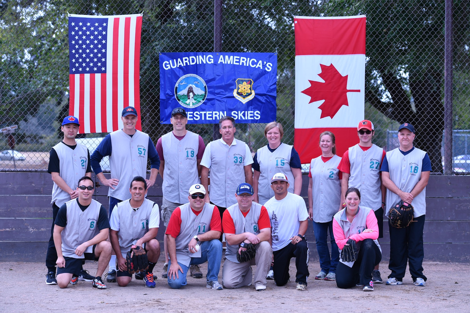 The Canadian Detachment softball team poses for a photo prior to the start of the Western Air Defense Sector U.S. vs Canada Softball Challenge Cup Sept. 1.  Pictured from left to right are: (back row)  Capt. Victor Choi, Major Brian Kynaston, Capt. Sean Anderson, Warrant Officer Gilles Turgeon, Capt. Barbara Steele, Corina Wappler, Chris Berkman, and Master Cpl. Brian Berkman. (Front row) Capt. Kenneth Mui, Major Marcelo Plada, Lt. Col. Matthew Wappler, Warrant Officer Richard Martin, Master Sgt. Gerald Sampson, and Kim Miller. (U.S. Air National Guard photo by Kimberly D. Burke)
