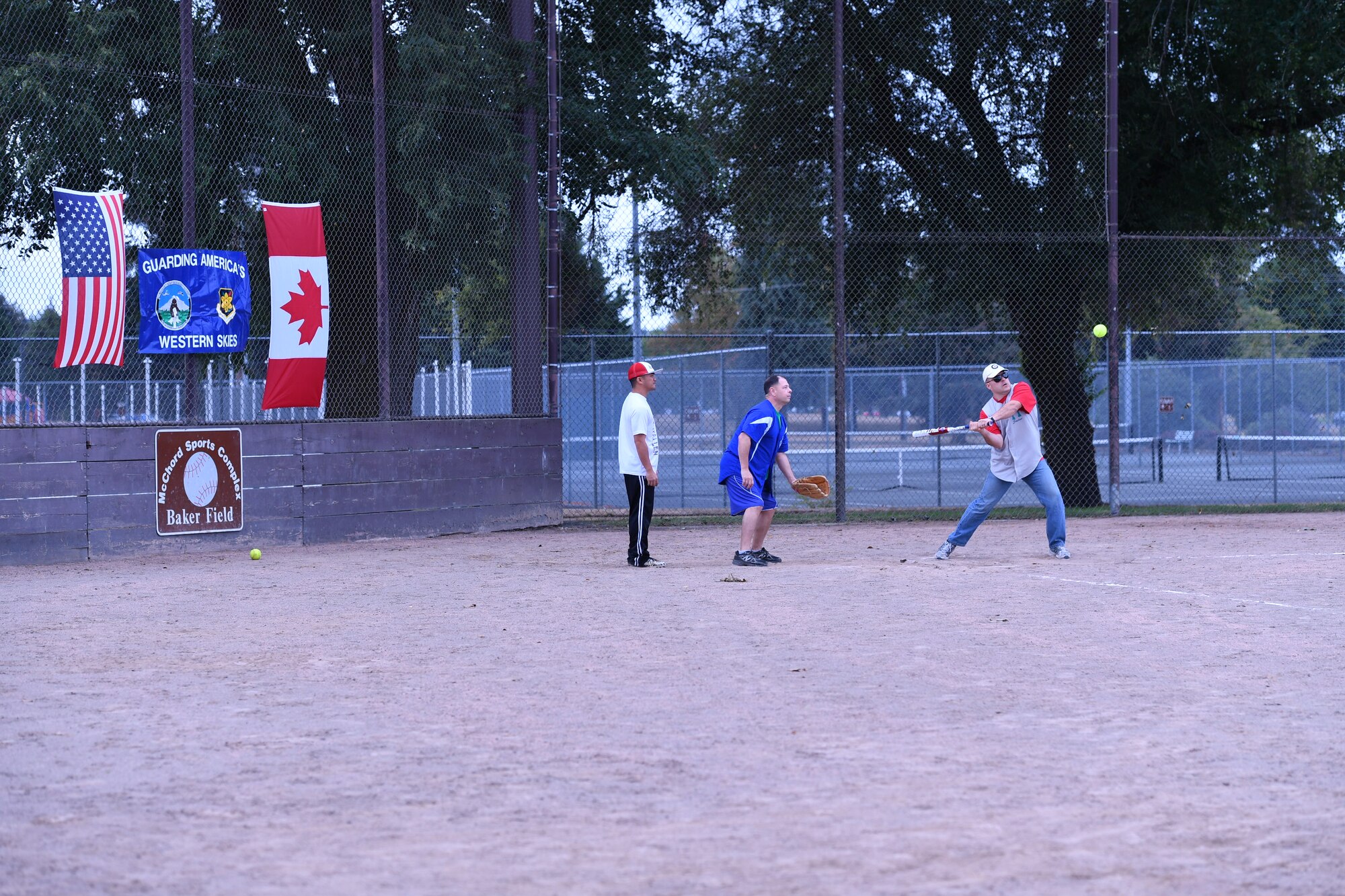 Canadian Detachment commander, Lt. Col. Matthew Wappler, hits a fly ball to left field during the Western Air Defense Sector U.S. vs Canada Softball Challenge Cup Sept. 1.  The U.S. won with a final score of 22 to 7. (U.S. Air National Guard photo by Capt. Kimberly D. Burke)