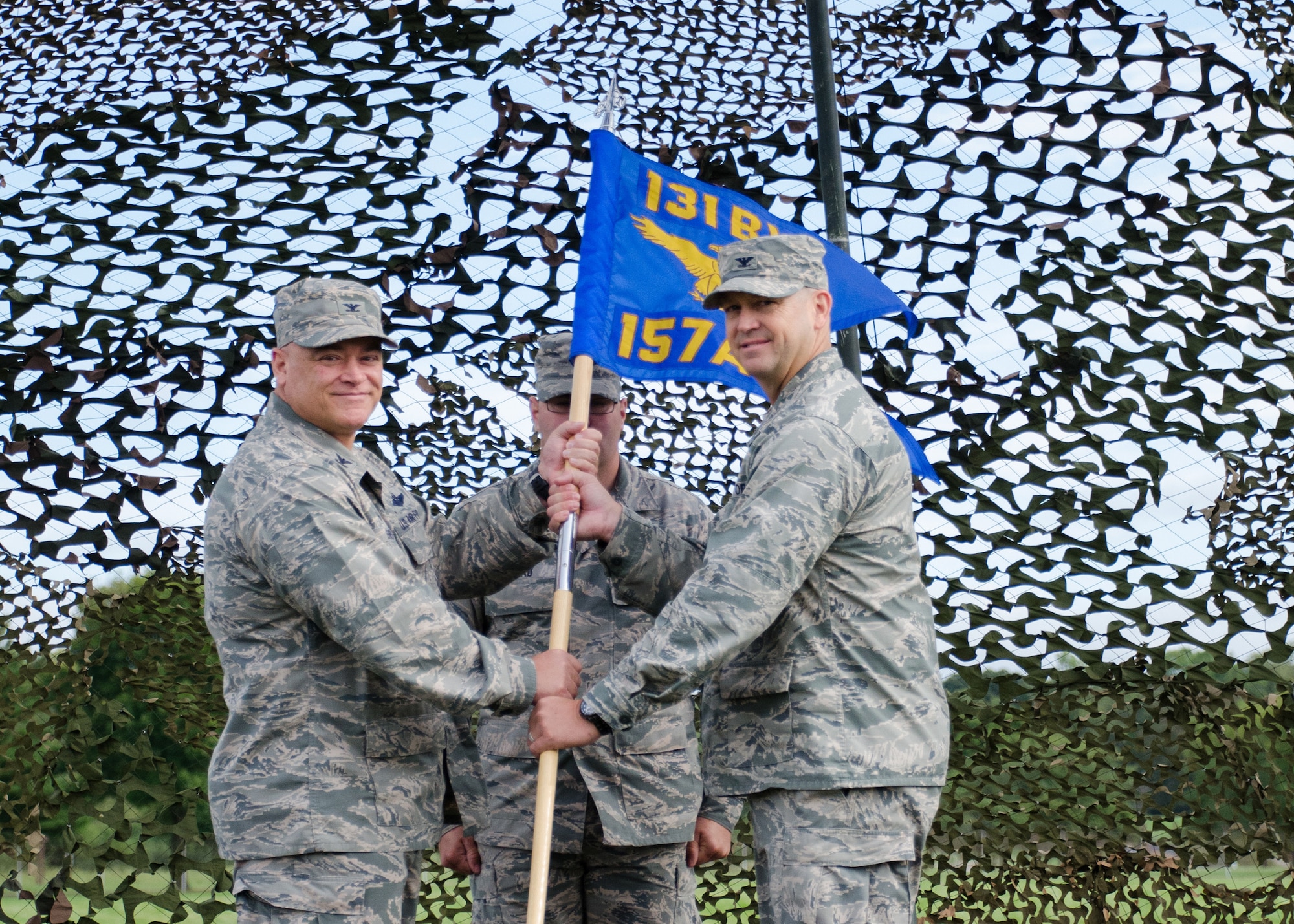 Col. Bill Boothman took command of the Missouri Air National Guard's 157th Air Operations Group during a change of command ceremony on the Parade Field at Jefferson Barracks, Missouri, Sept 10, 2016.  He is shown here accepting the guidon from 131st Bomb Wing commander, Col Ken Eaves.  (U.S. Air National Guard photo by Staff Sgt. Brittany Cannon)