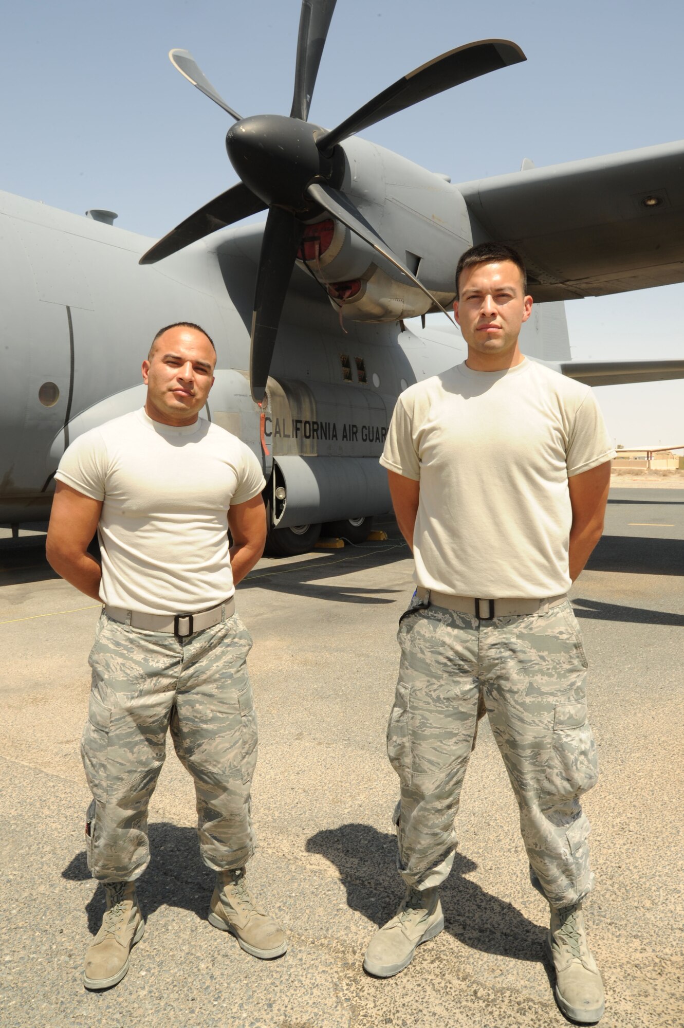 Brothers Staff Sgt. Walter Morales Talento, left, and Senior Airman Guido Morales, 386th Expeditionary Aircraft Maintenance Squadron aerospace maintainers, are deployed to the 386th Air Expeditionary Wing at an undisclosed location in Southwest Asia. This is the second time the brothers have been deployed together in their Air Force careers. (U.S. Air Force photo/Senior Airman Zachary Kee)