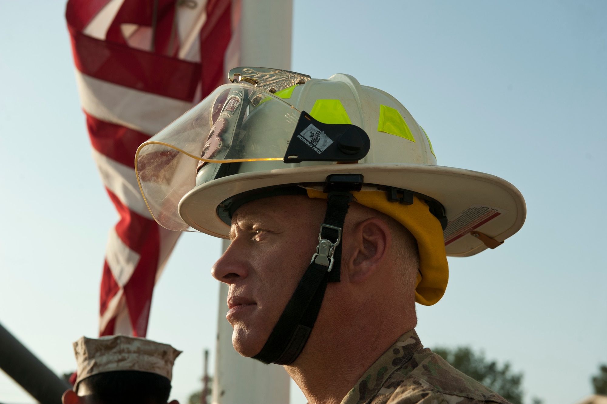 A firefighter with the Bagram fire department waits to begin a 9/11 remembrance ceremony, Bagram Airfield, Afghanistan, Sept. 11, 2016. Servicemembers and civilians from across Bagram gathered to remember the events of Sept. 11, 2001. (U.S. Air Force photo by Capt. Korey Fratini)