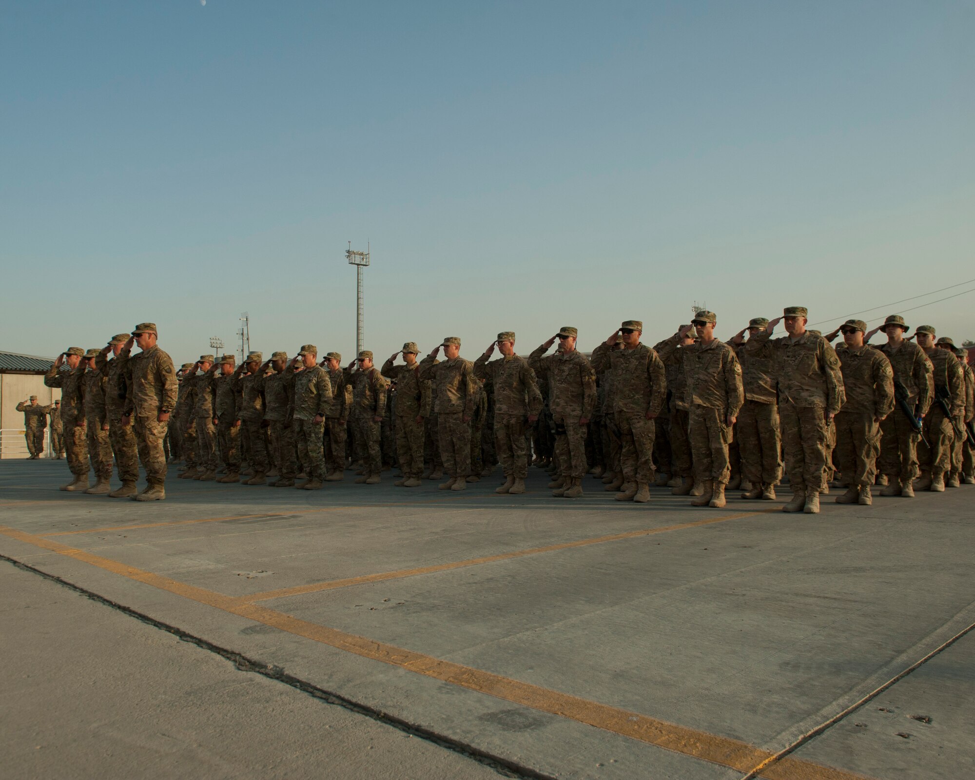 Servicemembers and civilians at Bagram Airfield, Afghanistan gathered to hold a 9/11 remembrance ceremony, Sept. 11, 2016. The ceremony involved a joint service honor guard  that conducted a retreat to remember those who gave their lives 15 years ago. (U.S. Air Force photo by Capt. Korey Fratini)