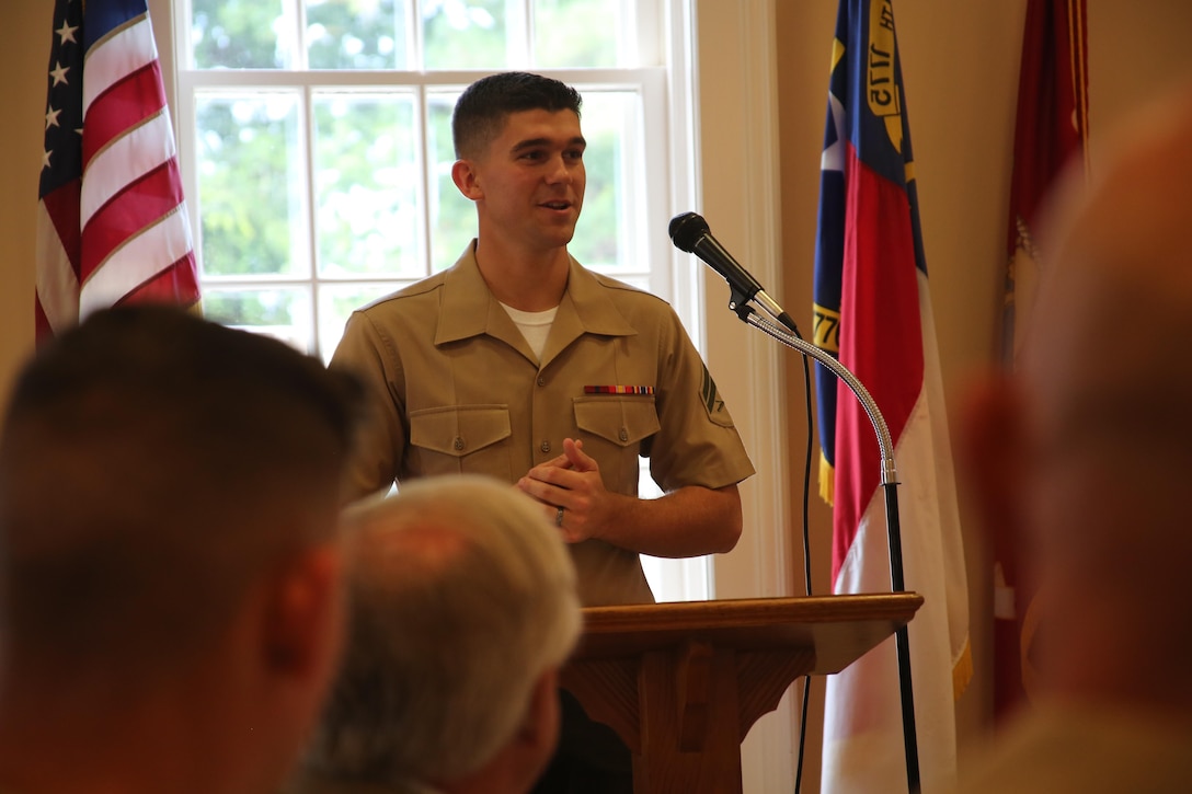 Cpl. Jared Hall delivers a speech during a reception at the New Bern Country Club in New Bern, N.C., Sept. 8. The Hall family received the Military Family of the Quarter Award during the reception. The family received awards, gifts, gift certificates and publicity from the Havelock Military Affairs Committee and the New Bern Military Alliance Committee in appreciation for their service. Hall is an aviation communications technician with Marine Air Support Squadron 1. (U.S. Marine Corps photo by Lance Cpl. Mackenzie Gibson/Released)
