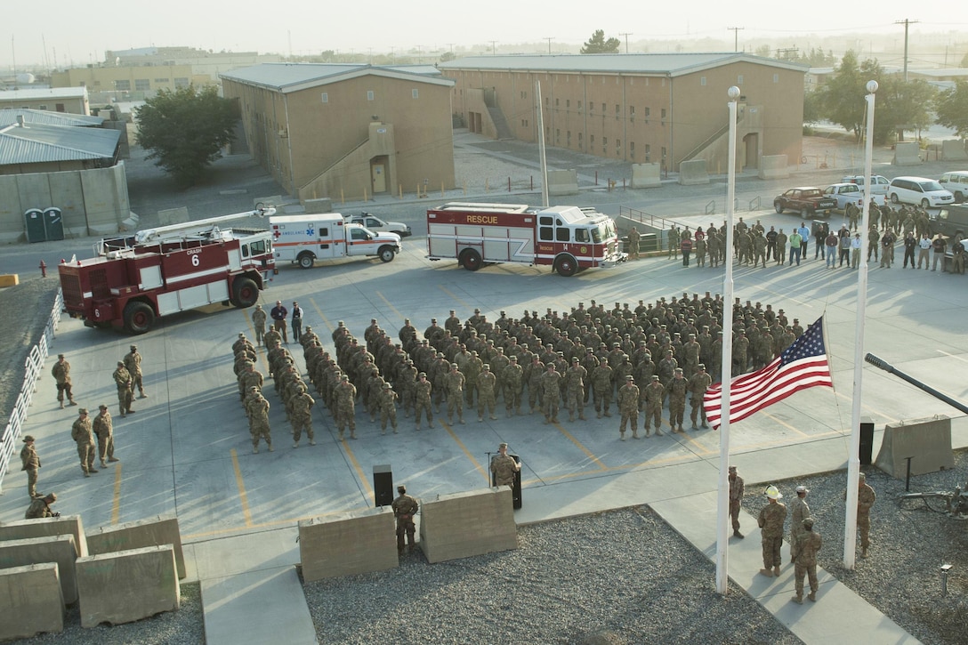 Service members and civilians gather for a 9/11 remembrance ceremony at Bagram Airfield, Afghanistan, Sept. 11, 2016. The ceremony included a joint service honor guard to pay tribute to those who lost their lives 15 years ago. Air Force photo by Capt. Korey Fratini