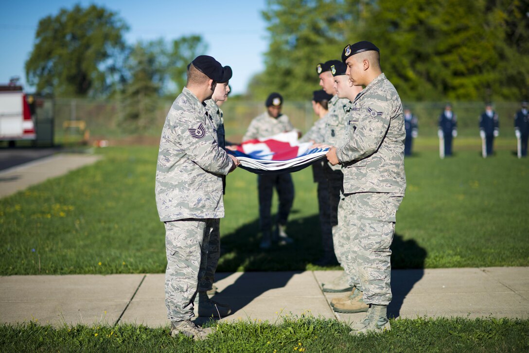 Members of the 914th Security Forces Squadron perform a flag folding ceremony as part of the 15th anniversary remembrance of the 9/11 terrorist attacks, September 11, 2016, Niagara Falls Air Reserve Station, N.Y. (U.S. Air Force photo by Tech. Sgt. Steph Sawyer) 