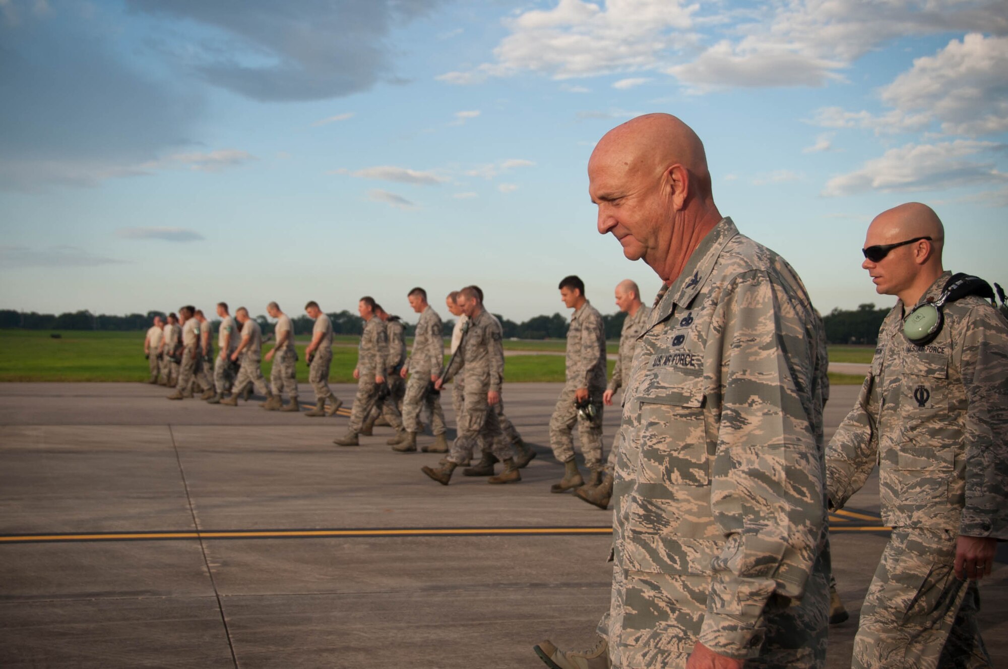 Col. Jay Johnson, 403rd Maintenance Group commander and Maj. Brian Horton, 803rd Aircraft Maintenance Squadron commander lead a foreign object debris, more commonly know as "FOD" walk to collect trash on the flight line before a ceremony activating the new 803rd AMXS(U.S. Air Force photo/Senior Airman Heather Heiney