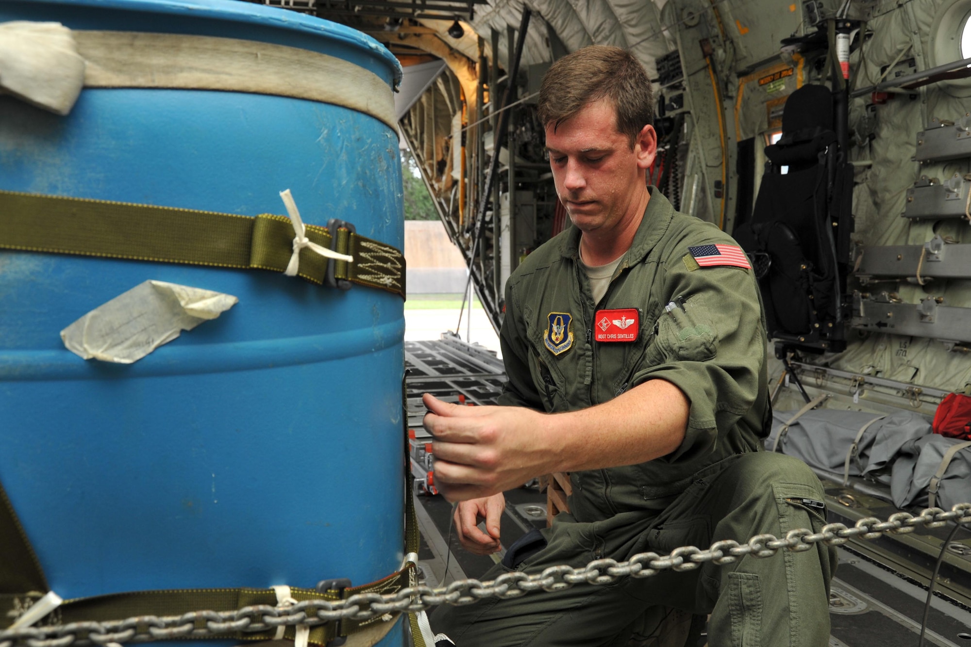 Master Sgt. Chris Sentilles, 815th Airlift Squadron loadmaster, secures a container delivery system on one of the squadron’s C-130J aircraft that took part in a four-aircraft training mission Sept. 11, 2016, over the Mississippi Gulfcoast. The aircraft took off from Keesler Air Force Base, Mississippi, and airdropped simulated cargo and heavy equipment over Stennis International Airport, Mississippi. (U.S. Air Force photo/Tech. Sgt. Ryan Labadens)