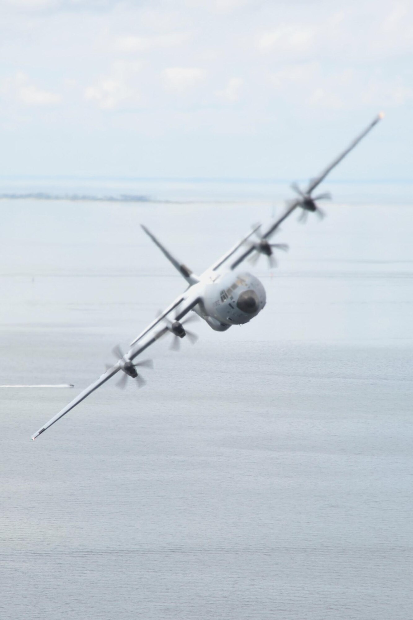 An 815th Airlift Squadron C-130J aircraft flies over the Mississippi Gulfcoast during a four-aircraft training mission Sept. 11, 2016. The aircraft took off from Keesler Air Force Base, Mississippi, and airdropped simulated cargo and heavy equipment over Stennis International Airport, Mississippi. (U.S. Air Force photo/Tech. Sgt. Ryan Labadens)