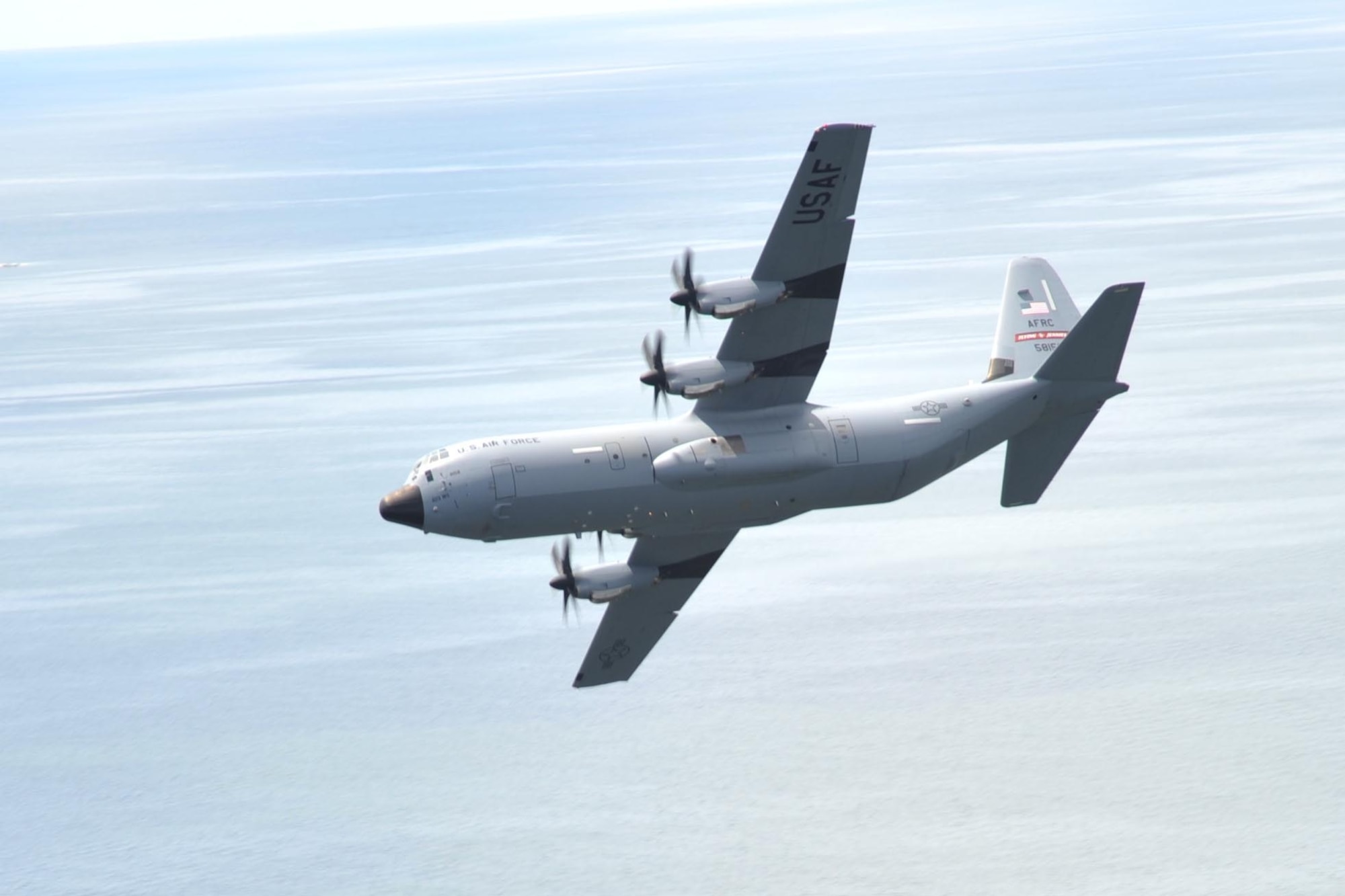 An 815th Airlift Squadron C-130J aircraft flies over the Mississippi Gulfcoast during a four-aircraft training mission Sept. 11, 2016. The aircraft took off from Keesler Air Force Base, Mississippi, and airdropped simulated cargo and heavy equipment over Stennis International Airport, Mississippi. (U.S. Air Force photo/Tech. Sgt. Ryan Labadens)