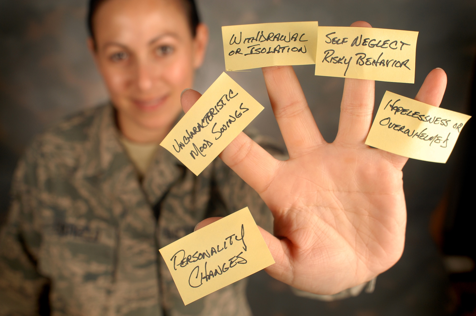 A member of the 111th Attack Wing, Horsham Air Guard Station, Pa., display the five signs that may mean someone is in emotional pain and might need help, Sept. 8, 2016. Guardsmen play a key role in spotting fellow service members at risk for suicide. (U.S. Air Force photo by Master Sgt. Chris Botzum)