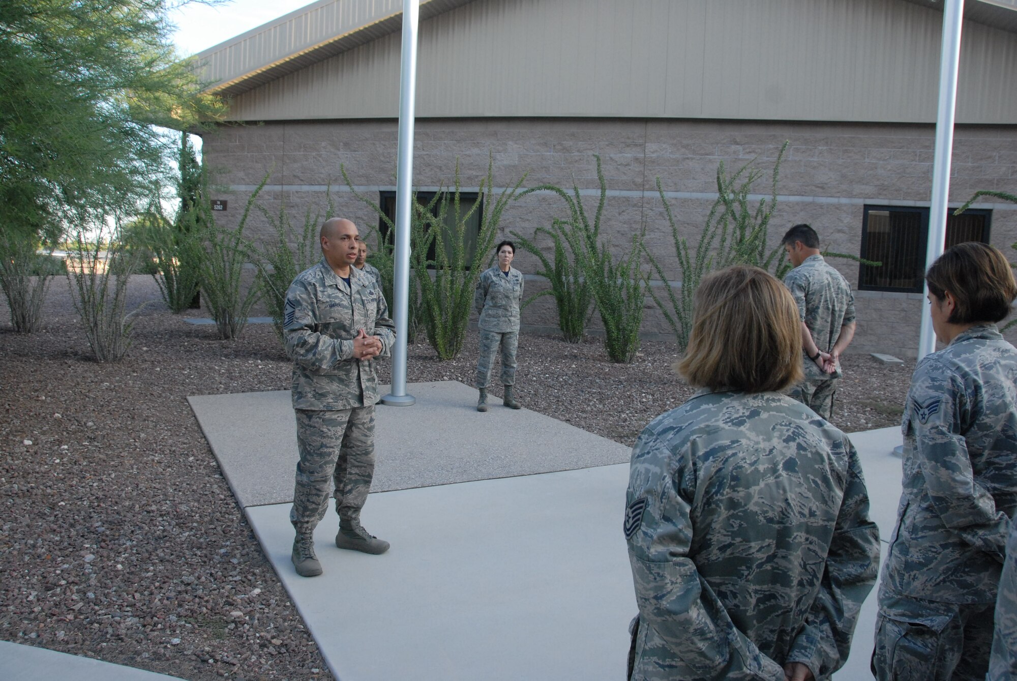 Senior Master Sgt. Jack Minaya speaks to Airmen attached to the 214th Reconnaissance Group during an observance of 9/11. Minaya, who recently was recognized as the Air National Guard’s Outstanding First Sergeant of the Year, is a native New Yorker who shared his personal memories about the terrorist attacks, and reminding his fellow Airmen their purpose in the war on terror. (U.S. National Guard photo by Tech. Sgt. Erich B. Smith)