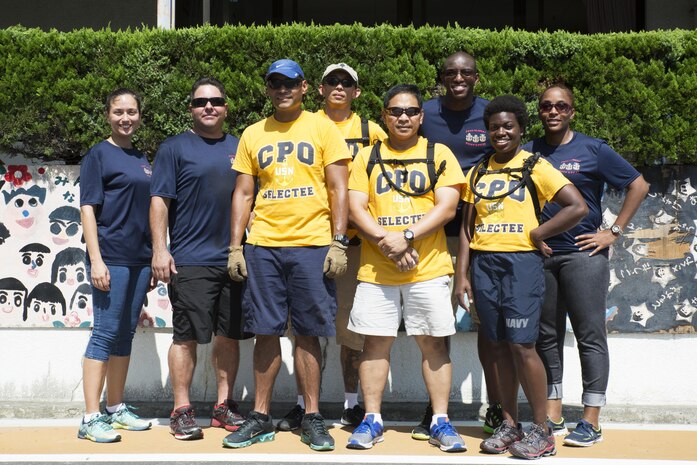 U.S. Navy Sailors of Marine Corps Air Station Iwakuni pose for a photo after volunteering at Ekimae Hoikuen preschool in Iwakuni, Japan, Sept. 8, 2016. The Sailors volunteered with the Marine Memorial Chapel in a project to assist the school in completing required maintenance during an ongoing community relations project. (U.S. Marine Corps photo by Lance Cpl. Joseph Abrego)