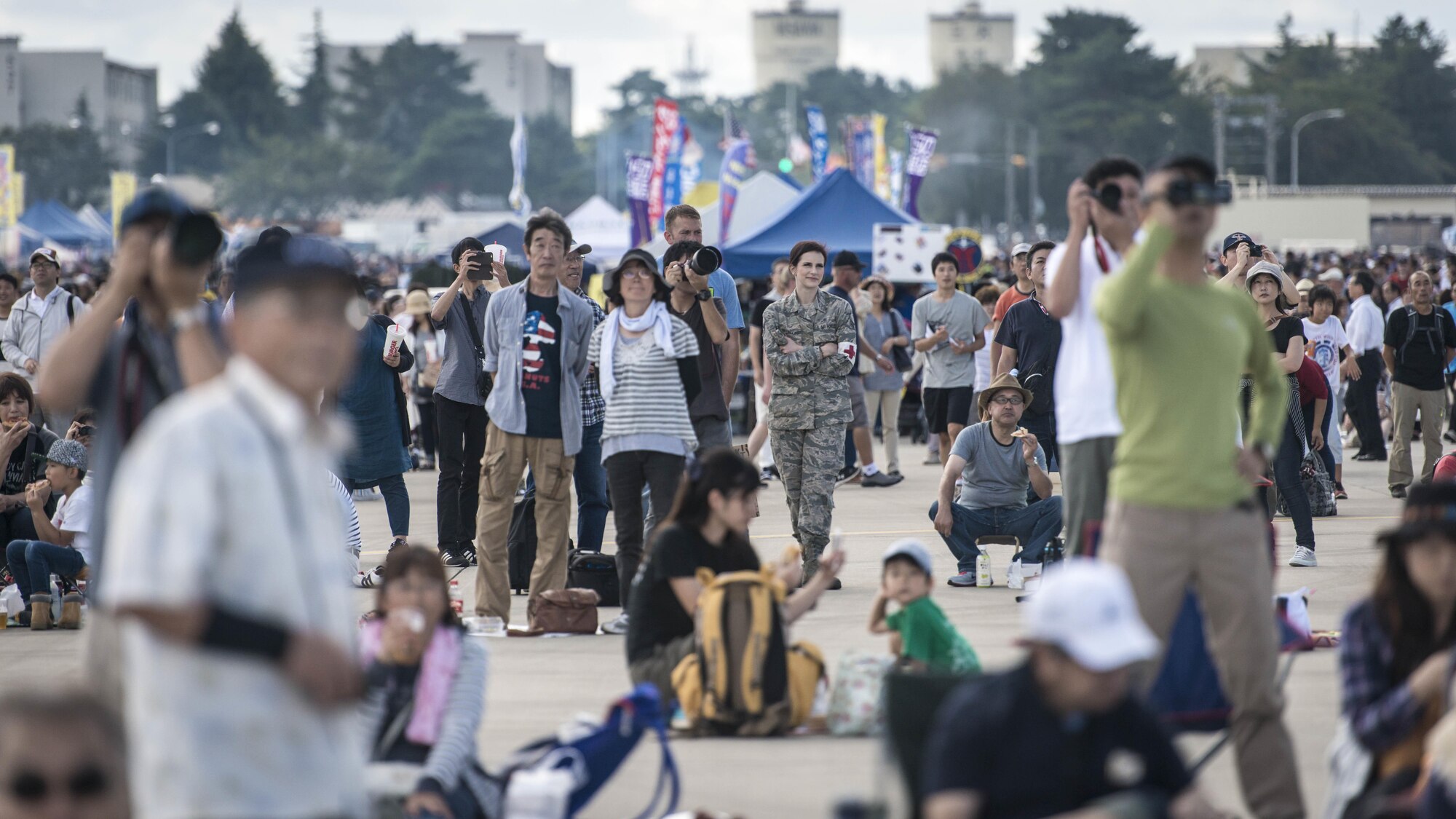 Crowds watch a Japan Air Self-Defense Force F-2 air-to-ground attack demonstration during Misawa Air Fest 2016 at Misawa Air Base, Japan, Sept. 11, 2016. More than 80,000 Japanese and Americans came out for the annual air show with performances ranging from the JASDF F-2 and U.S. Air Force F-16 Fighting Falcon, to the dozens of static displays and food booths scattered from one end of the flightline to the other. (U.S. Air Force photo by Staff Sgt. Benjamin W. Stratton)