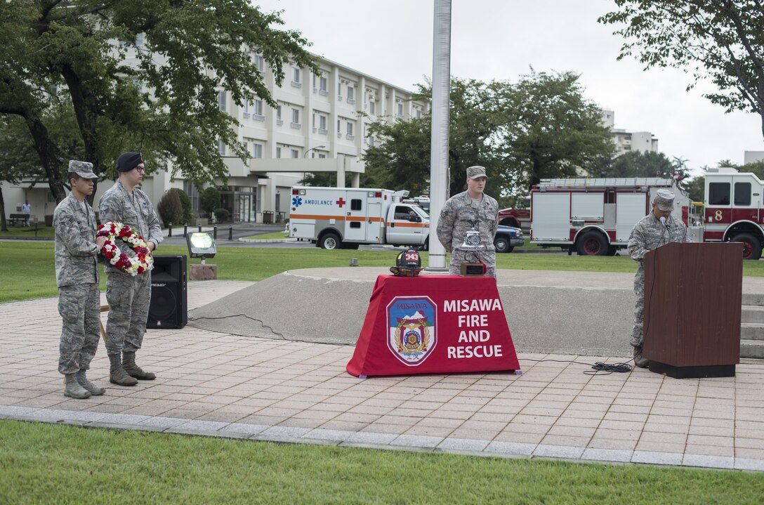 Airmen with the 35th Fighter Wing stand with a wreath and the “last alarm” during the 2016 POW/MIA and 9/11 remembrance ceremony at Misawa Air Base, Japan, Sept. 9, 2016. “It’s customary the ‘last alarm’ be sounded for our brothers and sisters who have paid the supreme sacrifice,” said Tech. Sgt. Ricardo Malan, 35th Civil Engineer Squadron assistant fire chief of operations. “For having selflessly given their lives for the good of their fellow man, their tasks completed, their duties well done, to signify they’re returning to quarters.” (U.S. Air Force photo by Senior Airman Brittany A. Chase) 