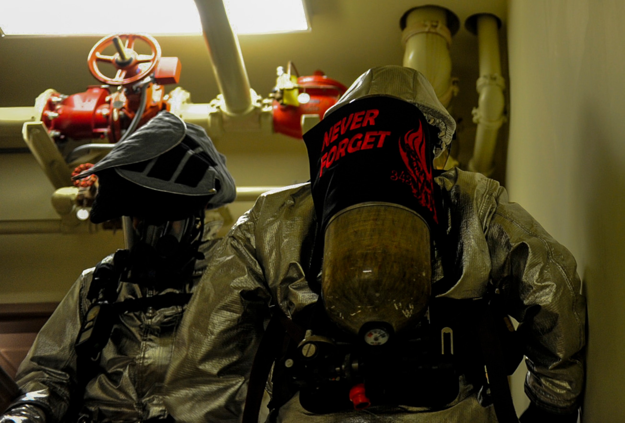 U.S. Air Force firefighters from the 8th Civil Engineer Squadron climb up flights of stairs at Kunsan Air Base, Republic of Korea, Sept. 12, 2016. The 9/11 memorial stair climb event is a tribute to the 343 firefighters who gave their lives during the tragic events at the World Trade Center on September 11, 2001. (U.S. Air Force photo by Senior Airman Colville McFee/Released)