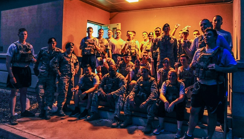 U.S. Air Force airmen from the 8th Civil Engineer Squadron fire department, 8th Medical Group and 8th Security Forces Squadron take a group photo while holding pieces of paper with the names of the New York Fire Department fire fighters to honor them at Kunsan Air Base, Republic of Korea, Sept. 12, 2016. The airmen were part of a 9/11 memorial stair climb event, which paid tribute to the 343 firefighters who gave their lives during the tragic events at the World Trade Center on September 11, 2001. (U.S. Air Force photo by Senior Airman Colville McFee/Released)