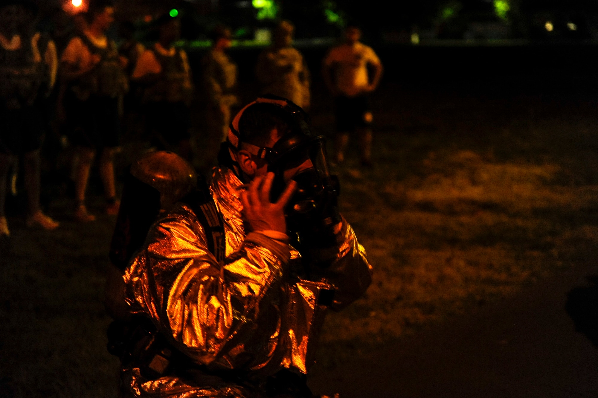 A U.S. Air Force firefighter from the 8th Civil Engineer Squadron puts on his mask before the start of the 9/11 memorial stair climb at Kunsan Air Base, Republic of Korea, Sept. 12, 2016. The 9/11 memorial stair climb event is a tribute to the 343 firefighters who gave their lives during the tragic events at the World Trade Center on September 11, 2001. (U.S. Air Force photo by Senior Airman Colville McFee/Released)