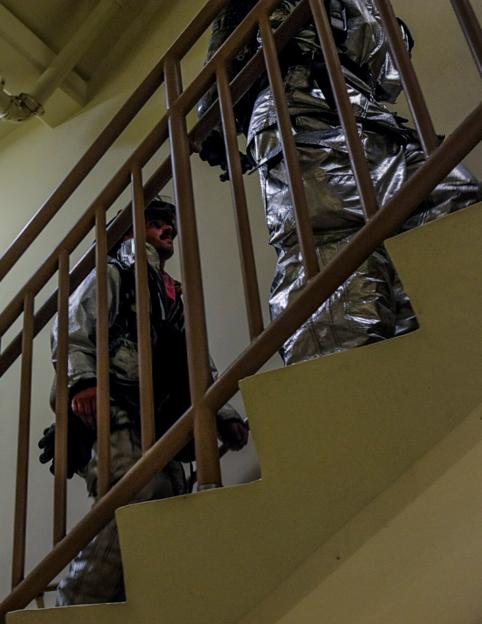 U.S. Air Force firefighters from the 8th Civil Engineer Squadron climb up flights of stairs at Kunsan Air Base, Republic of Korea, Sept. 12, 2016. The 9/11 memorial stair climb event is a tribute to the 343 firefighters who gave their lives during the tragic events at the World Trade Center on September 11, 2001. (U.S. Air Force photo by Senior Airman Colville McFee/Released)