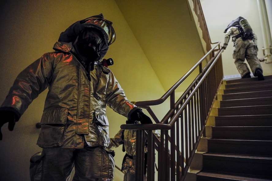 U.S. Air Force firefighters from the 8th Civil Engineer Squadron climb up flights of stairs at Kunsan Air Base, Republic of Korea, Sept. 12, 2016. The 9/11 memorial stair climb event is a tribute to the 343 firefighters who gave their lives during the tragic events at the World Trade Center on September 11, 2001. (U.S. Air Force photo by Senior Airman Colville McFee/Released)