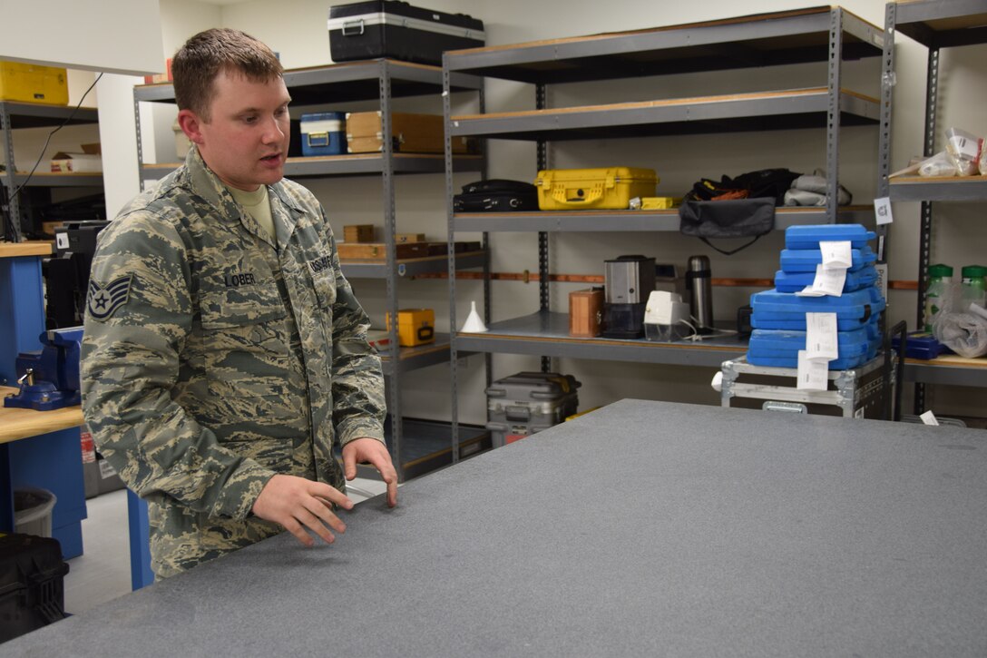A granite table, weighing a ton, is used to represents a true flat surface when 379th Expeditionary Expeditionary Maintenance Squadron Precision Measurement Equipment Laboratory is balancing equipment. Staff Sgt. Jacob Lober, a PMEL craftsman, went on to explain that the table aids technicians in finding a stable reading when the PMEL repairs rquipment  Aug. 24, 2016, Al Udeid Air Base, Qatar. (U.S. Air Force photo/Technical Sgt. CarlosJ.  Treviño/Released)